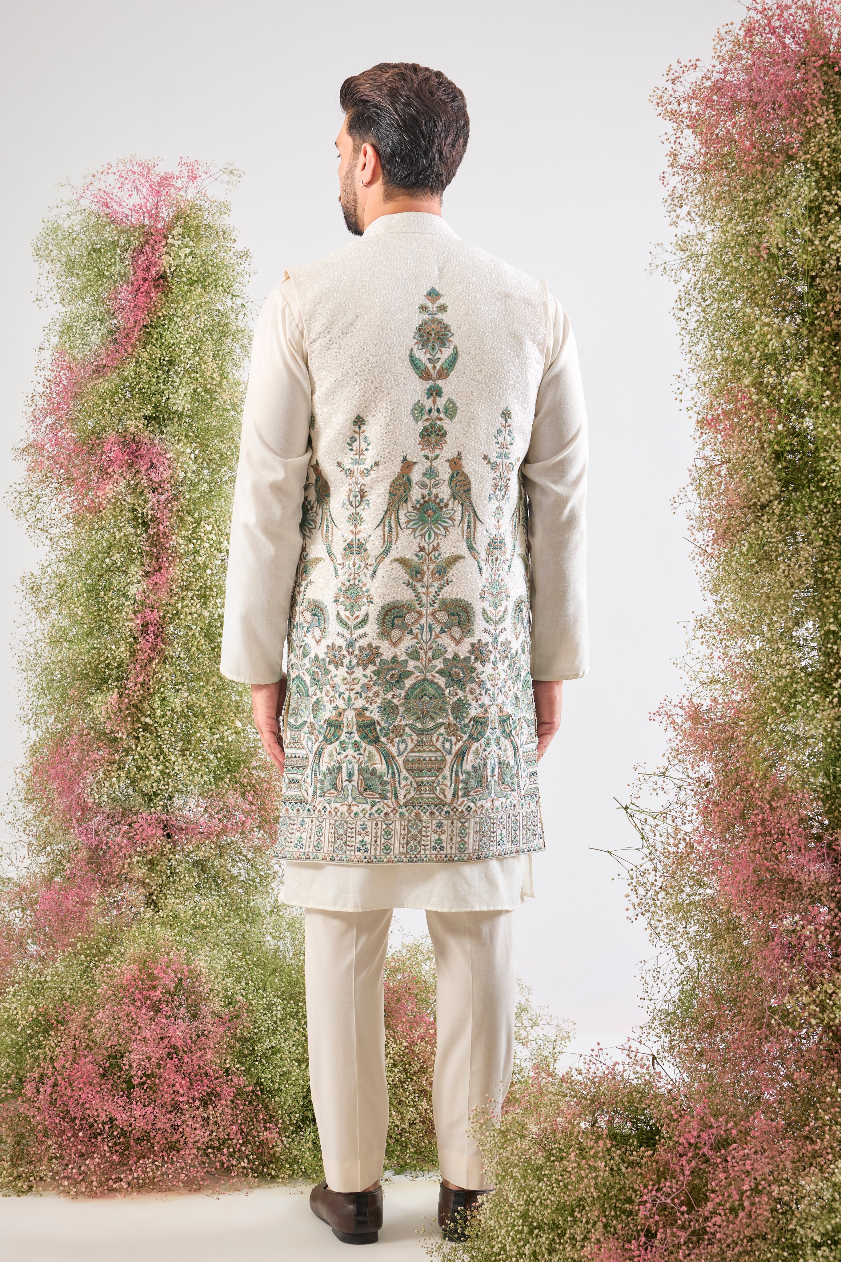 White brilliance. Grand design. Our Long Open Jacket features dazzling sequins and spectacular Detailed Flora and Fauna Embroidery. Simply unforgettable. 🦢