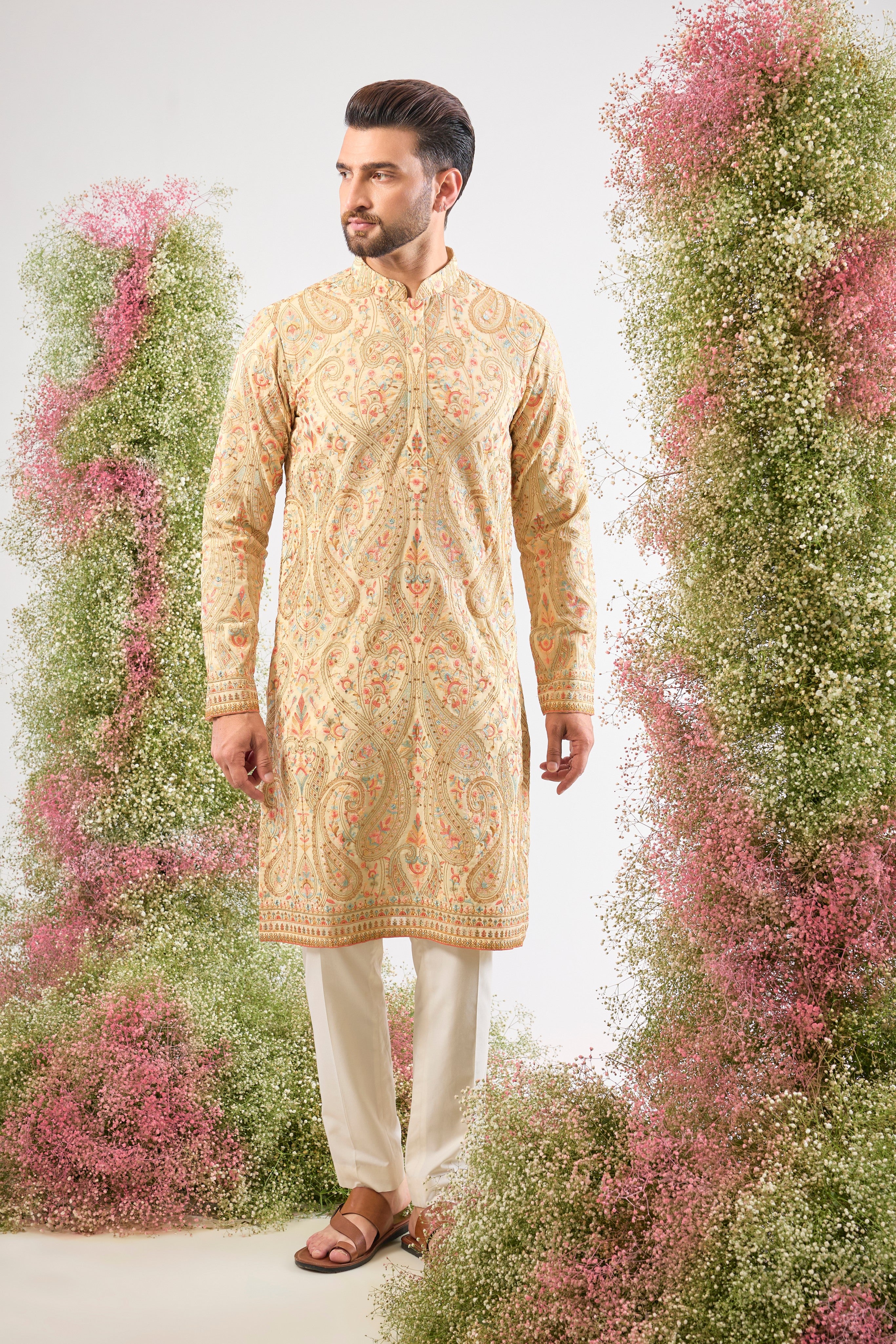 A celebration of thread and texture! This stunning Cream Kurta features exquisite Kashmiri Embroidery using a blend of Intricate Multi-threads. The result is a vibrant, textured pattern that brings depth and life to the classic cream base