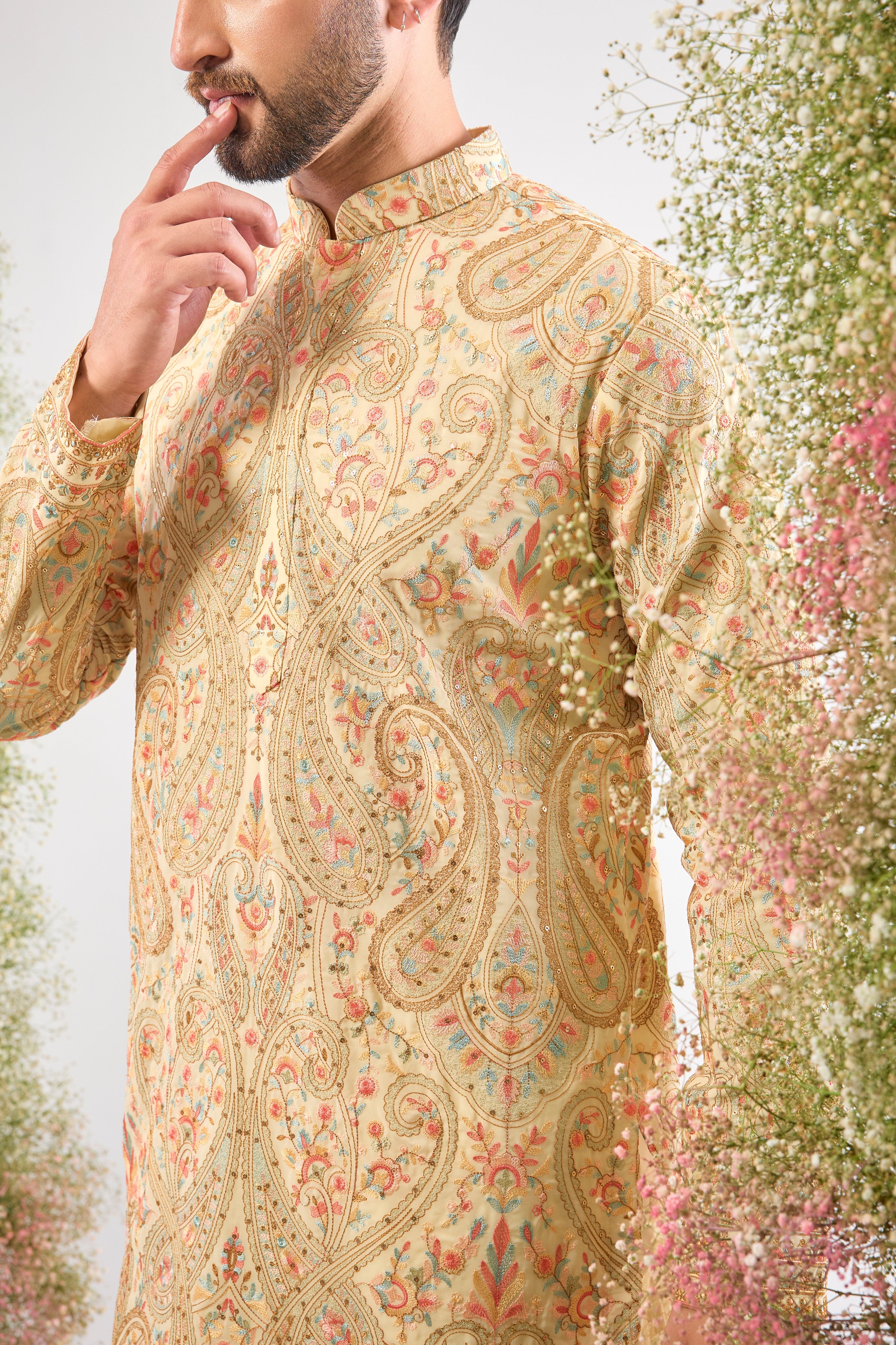 A celebration of thread and texture! This stunning Cream Kurta features exquisite Kashmiri Embroidery using a blend of Intricate Multi-threads. The result is a vibrant, textured pattern that brings depth and life to the classic cream base