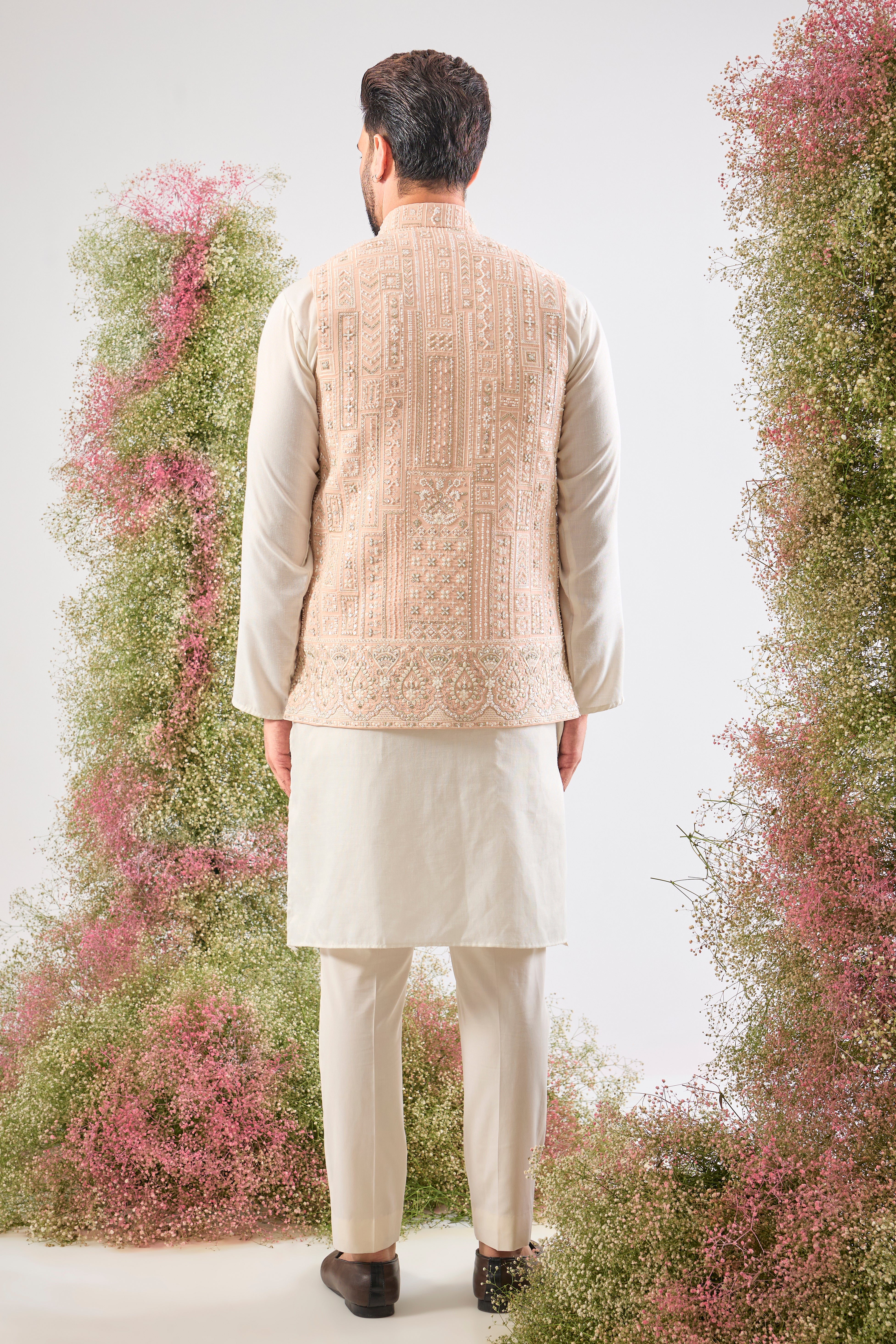 Pink perfection. Our Short Nehru Jacket features beautiful Hand Work with Detailed White Cut Dana and Sequins. Pure elegance.