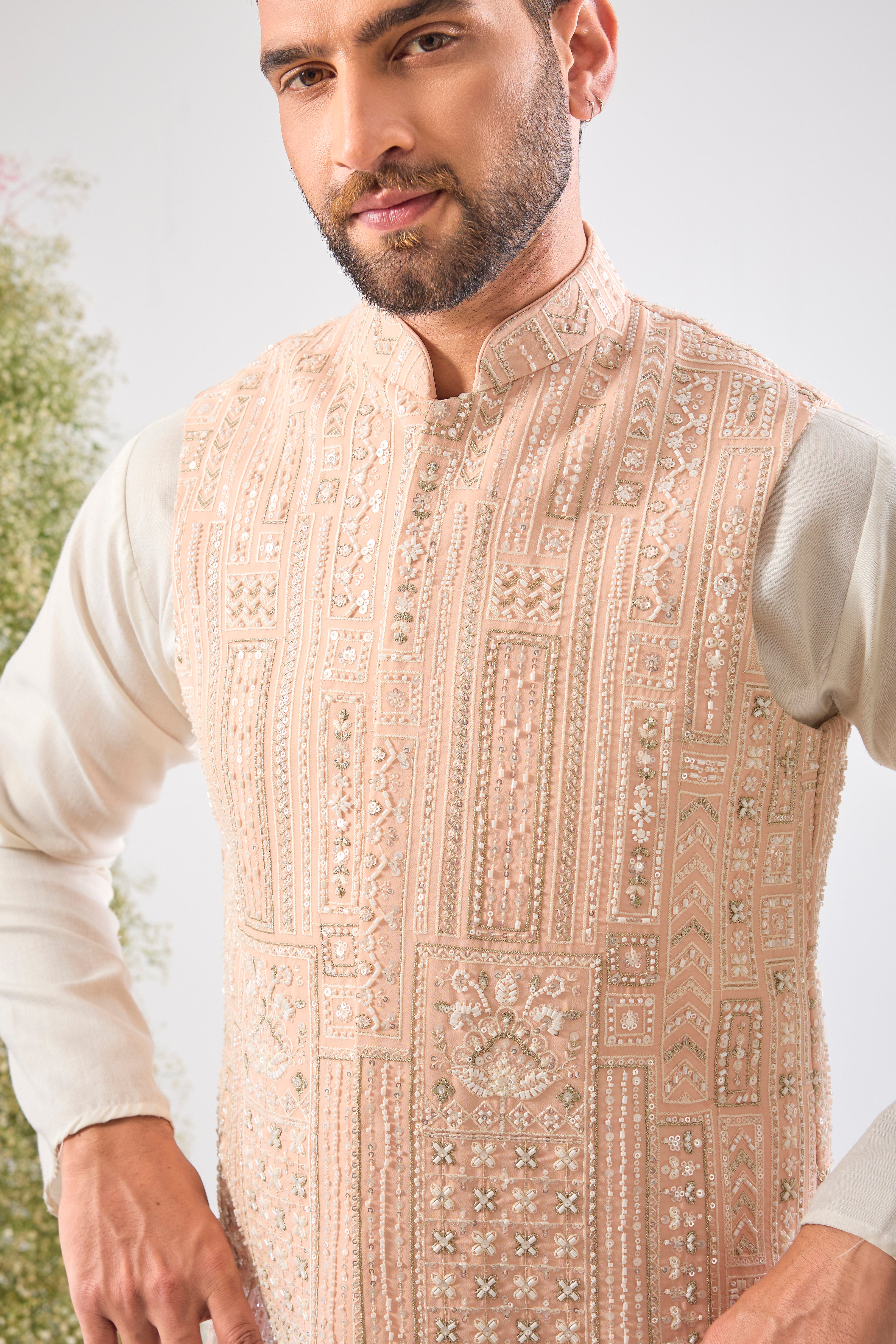 Pink perfection. Our Short Nehru Jacket features beautiful Hand Work with Detailed White Cut Dana and Sequins. Pure elegance.