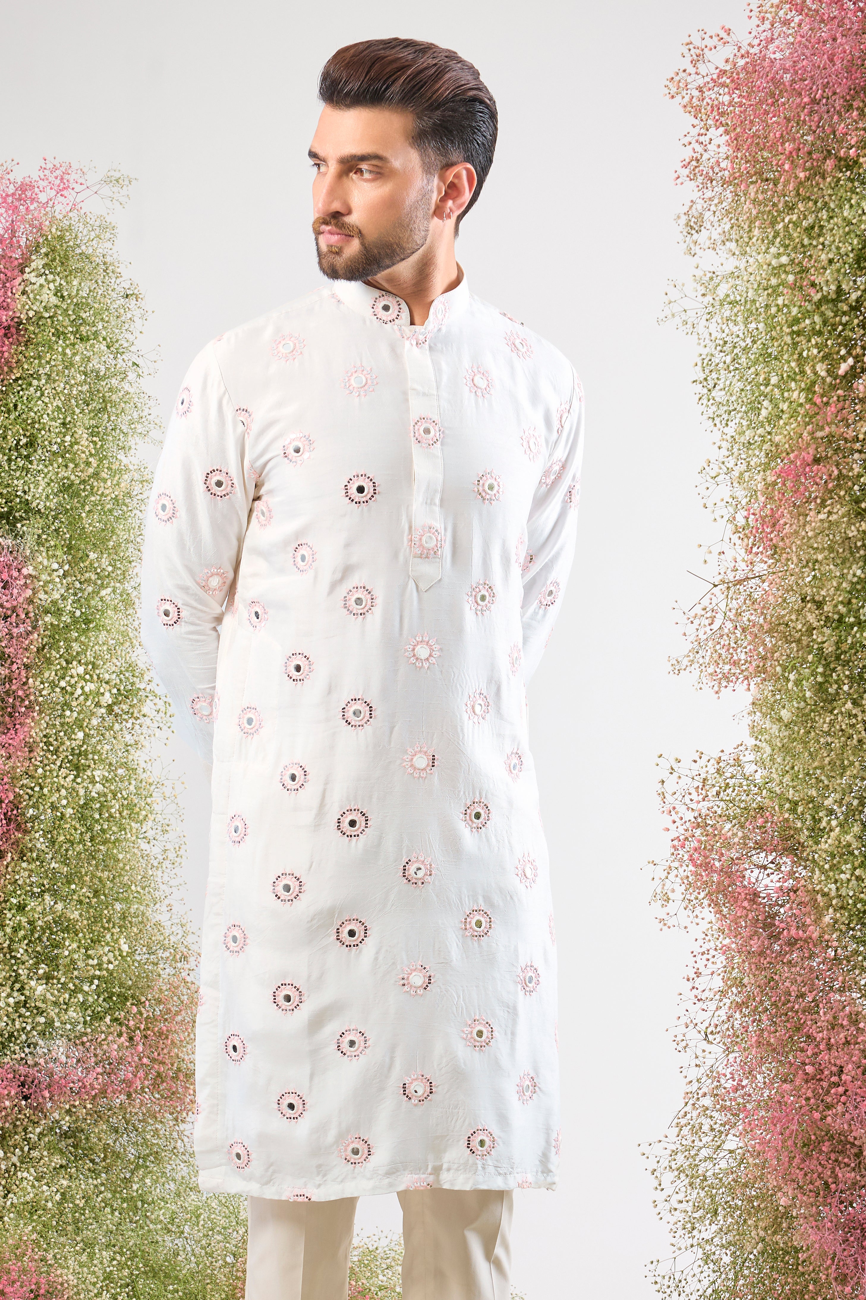 Super classy. Super subtle. Our White Kurta features elegant Powder Pink Thread Work and mirror-effect Sequin Detailing. A look of pure sophistication.