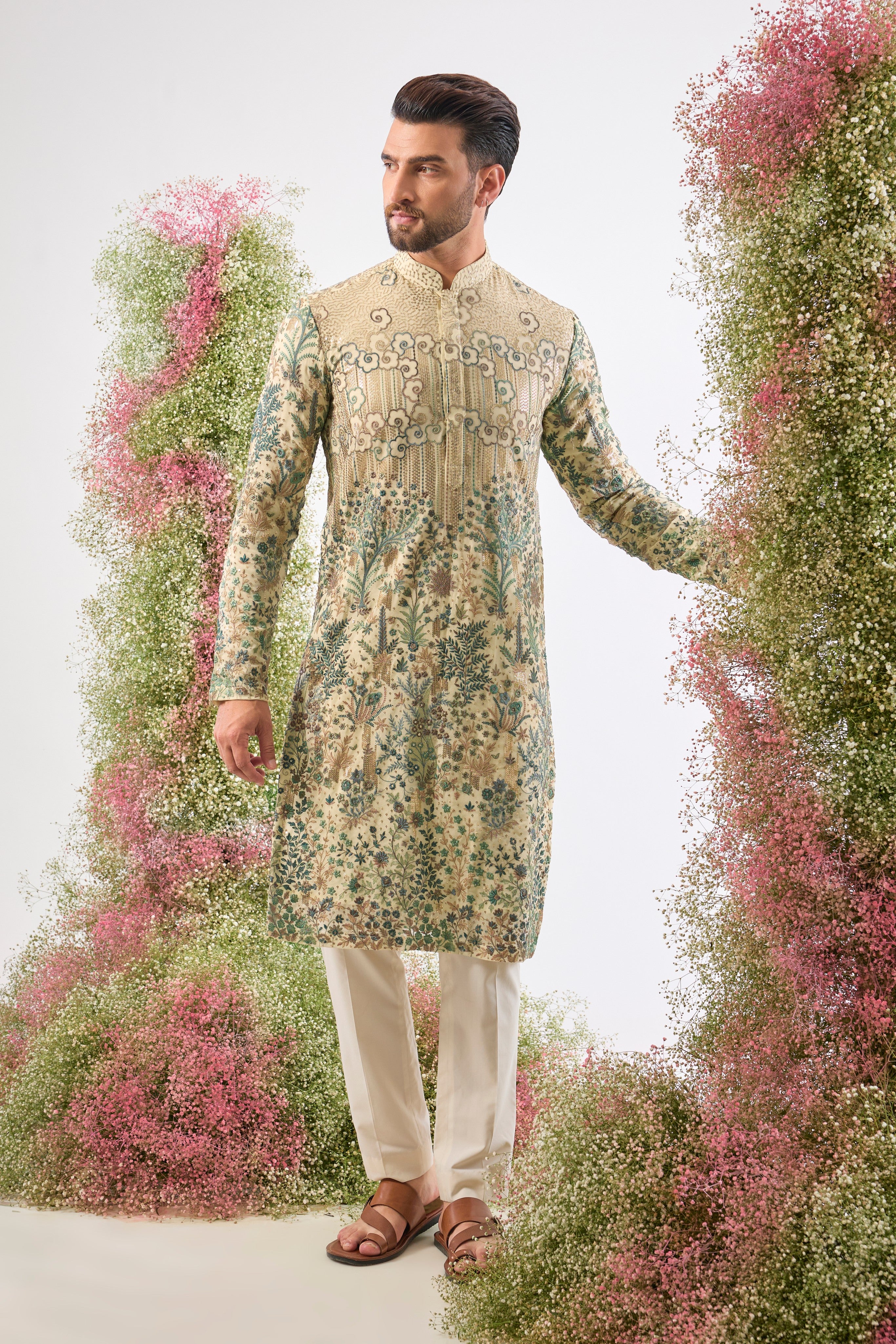 Wear a piece of art. This breathtaking Ivory Cream Kurta features a Detailed Floral Tropical Era design, showcasing intricate artistry in Green and Cream Threadwork.