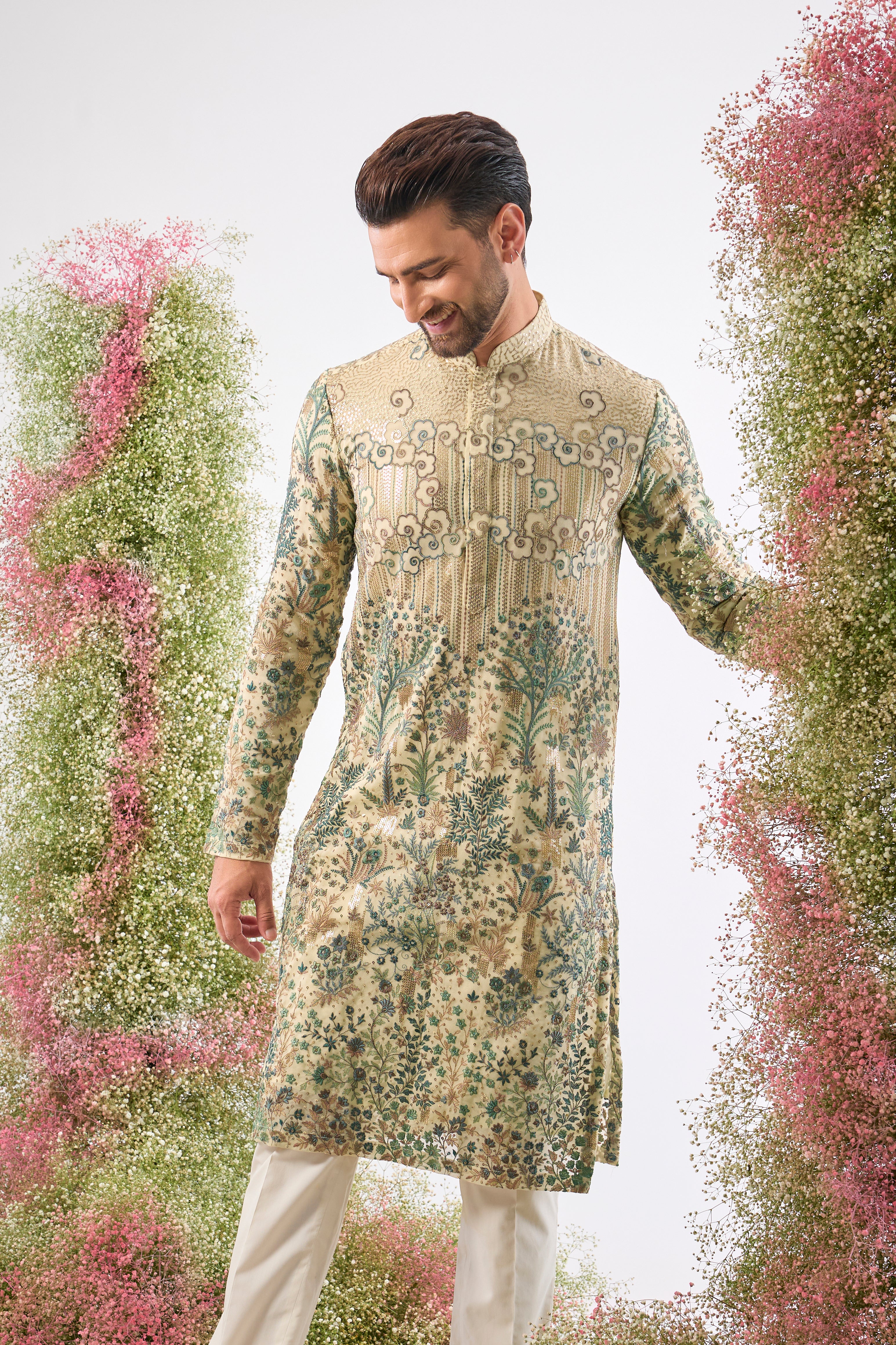 Wear a piece of art. This breathtaking Ivory Cream Kurta features a Detailed Floral Tropical Era design, showcasing intricate artistry in Green and Cream Threadwork.
