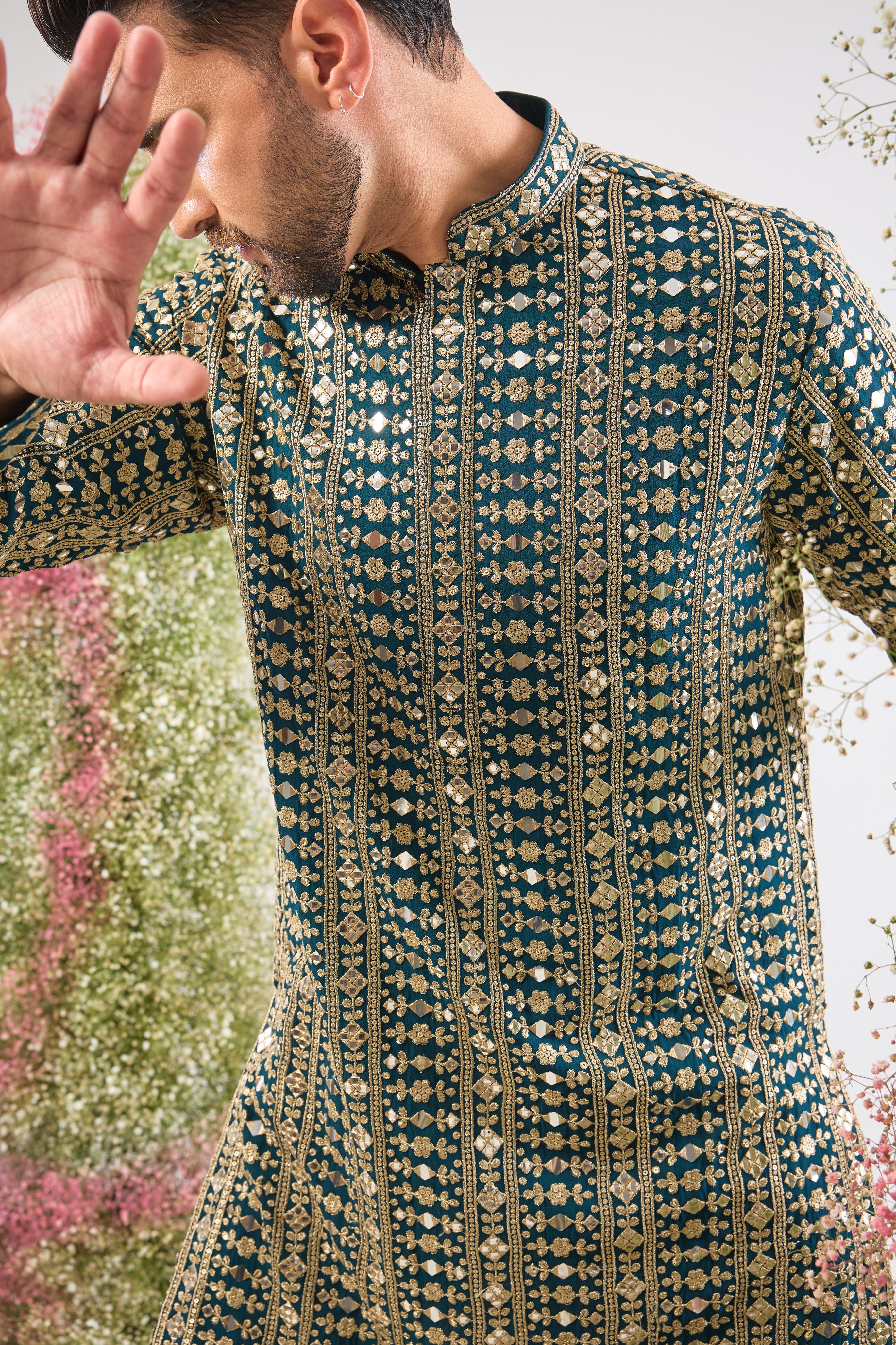 This Mirror Work Kurta showcases the grandeur of Heavy Zari and Sequin Work, providing unmatched brilliance and texture. The stunning colour and dense handwork create an aura of sophisticated festive luxury.