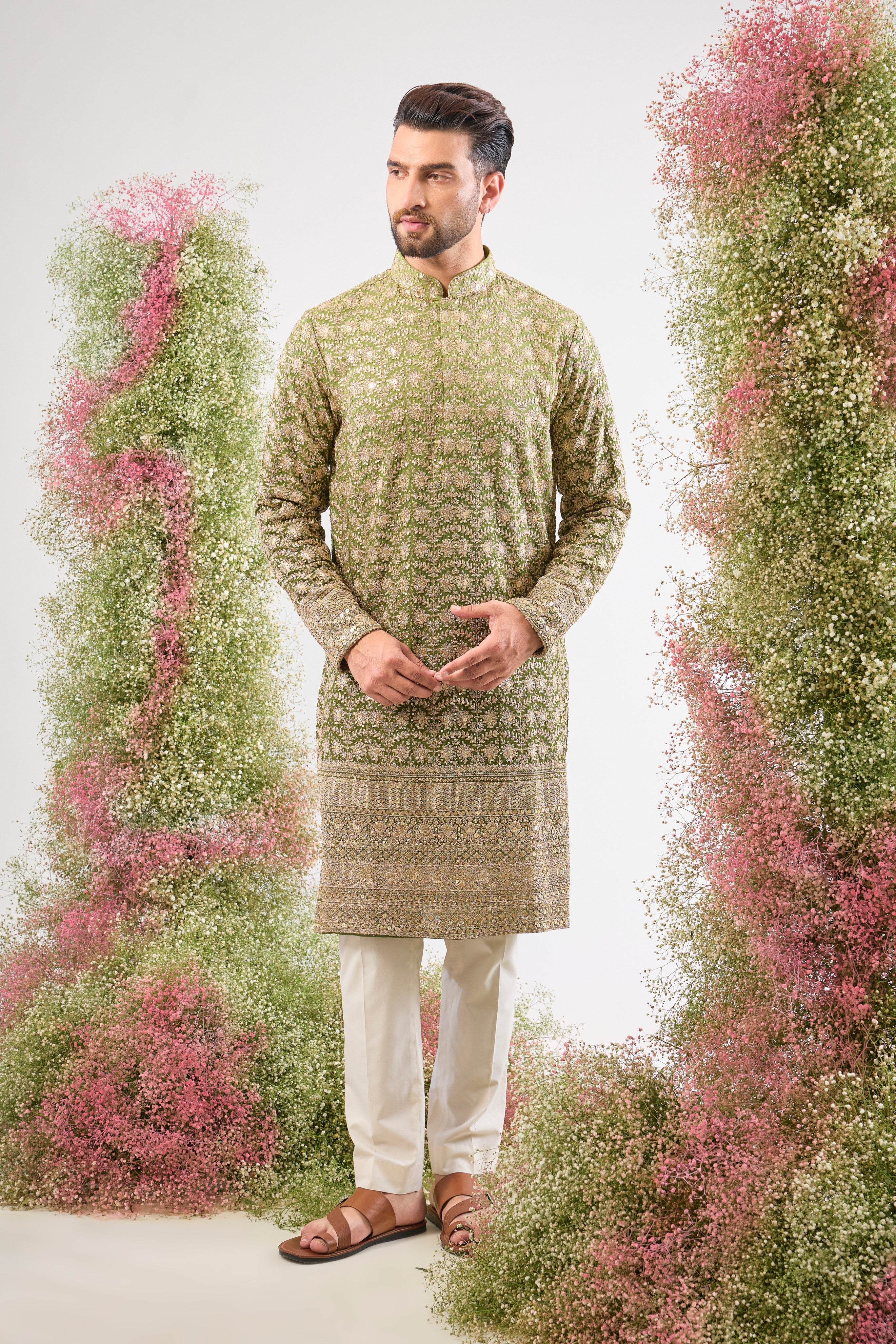 This Ombre Shaded Kurta showcases the richness of Intricate Zari and Sequin Work, perfectly complemented by a beautifully Detailed Ghera. The gradient and embellishment create an unparalleled sense of movement and luxury.