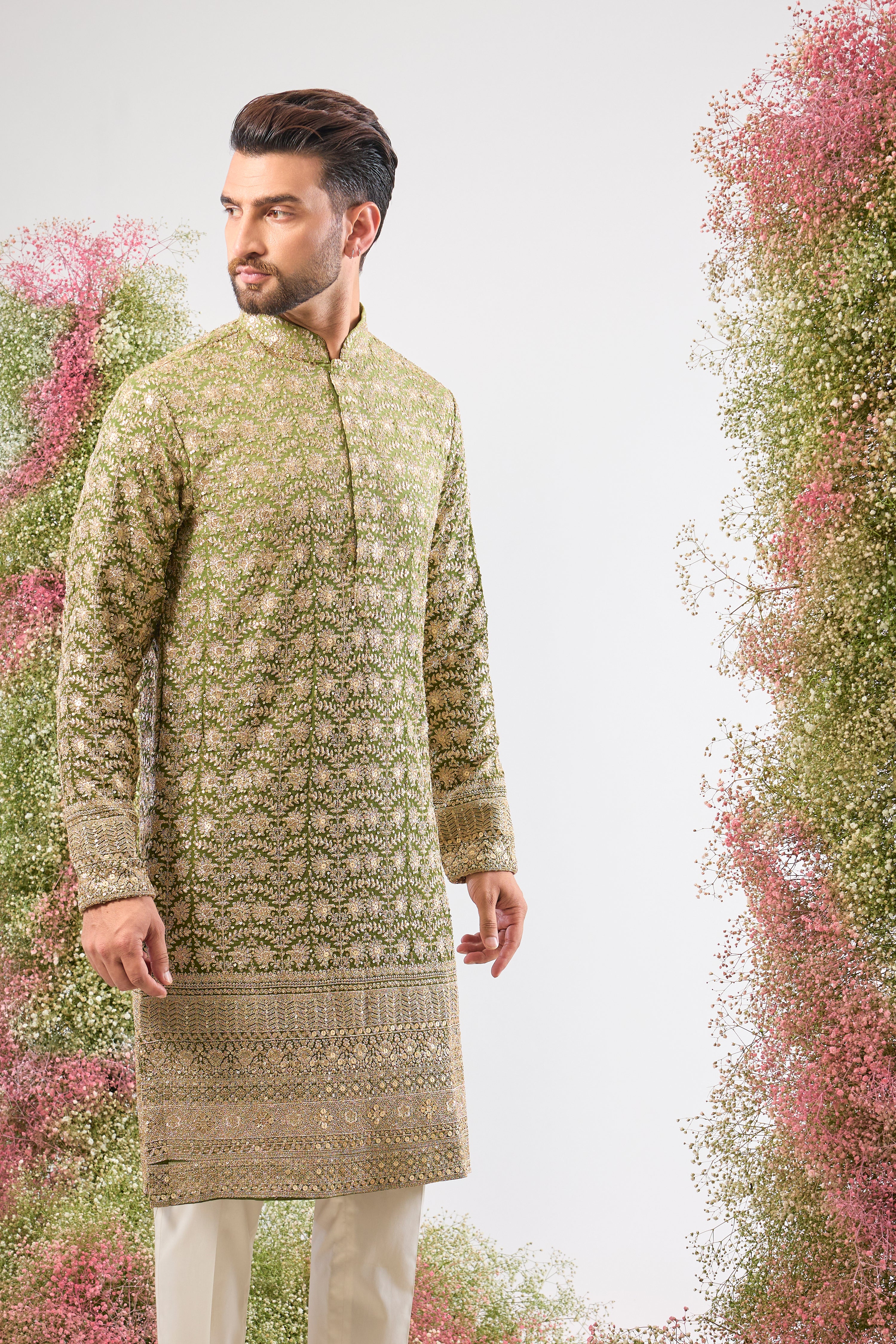 This Ombre Shaded Kurta showcases the richness of Intricate Zari and Sequin Work, perfectly complemented by a beautifully Detailed Ghera. The gradient and embellishment create an unparalleled sense of movement and luxury.
