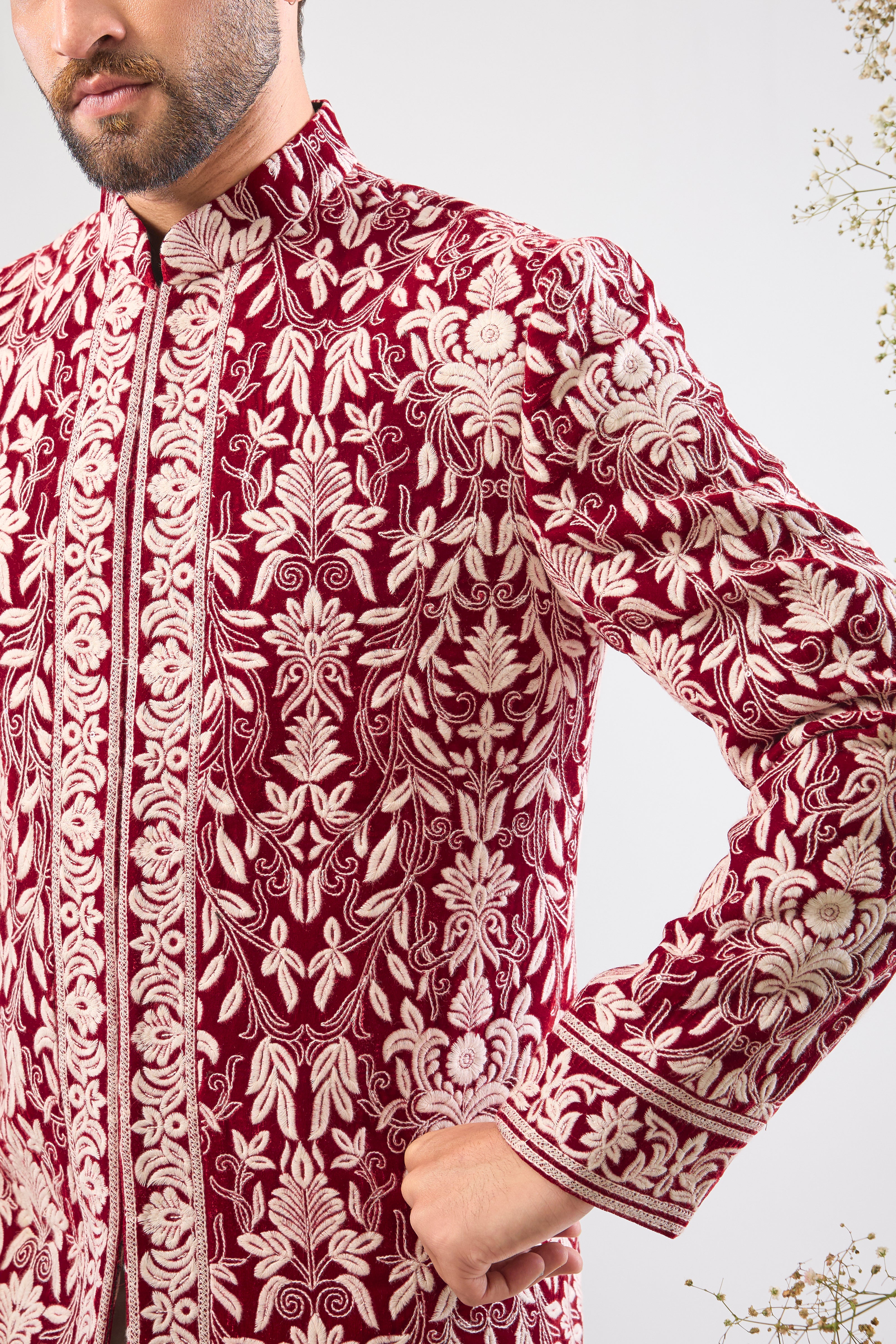 Our Maroon Sherwani on Velvet is a masterpiece, showcasing rich velvet fabric adorned with exquisite White Threadwork in a classic Kashmiri Embroidery Pattern