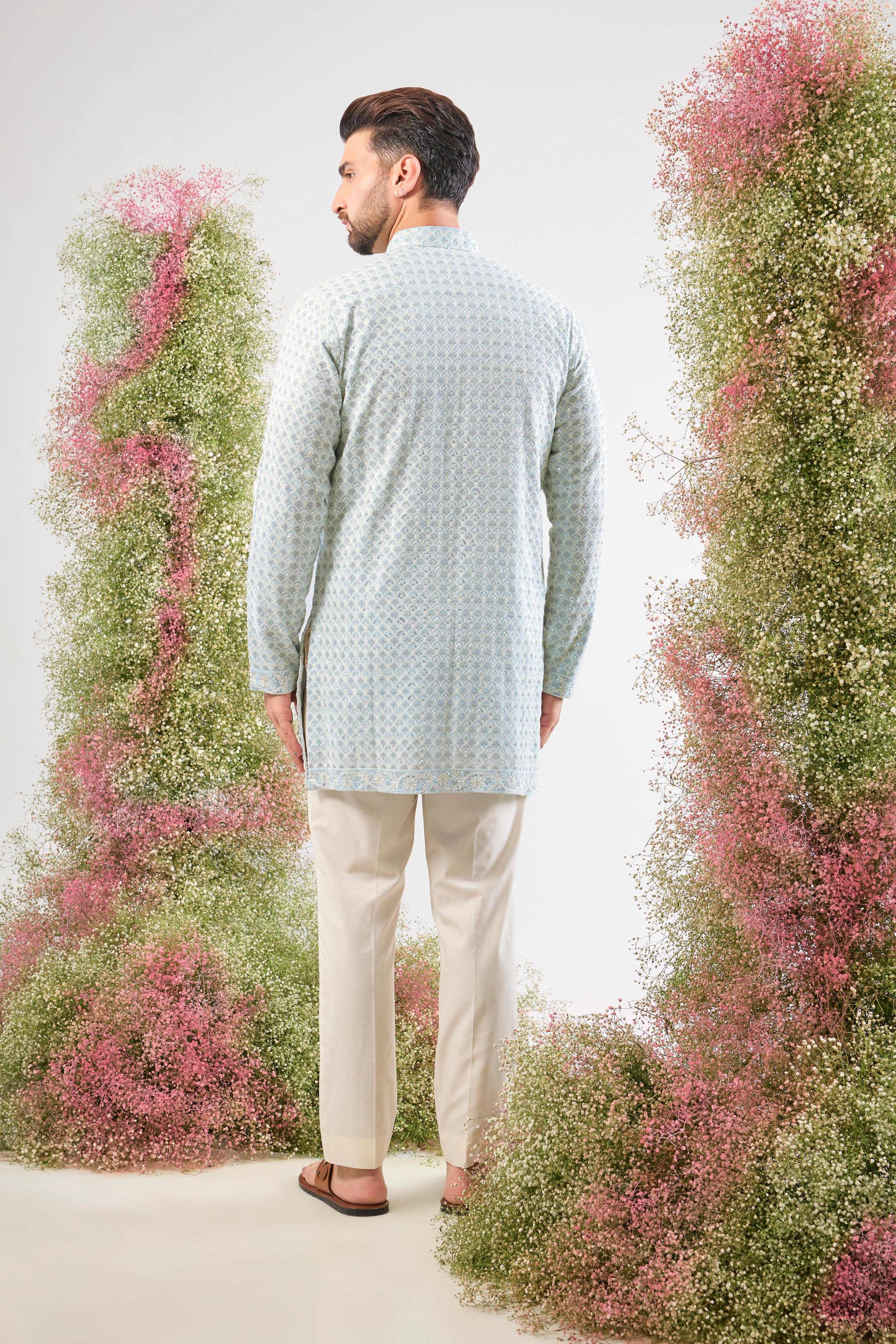 A delicate balance of tradition and dazzle: This Blue Chikankari Short Kurta features exquisite hand-stitched patterns in Cream Thread Work