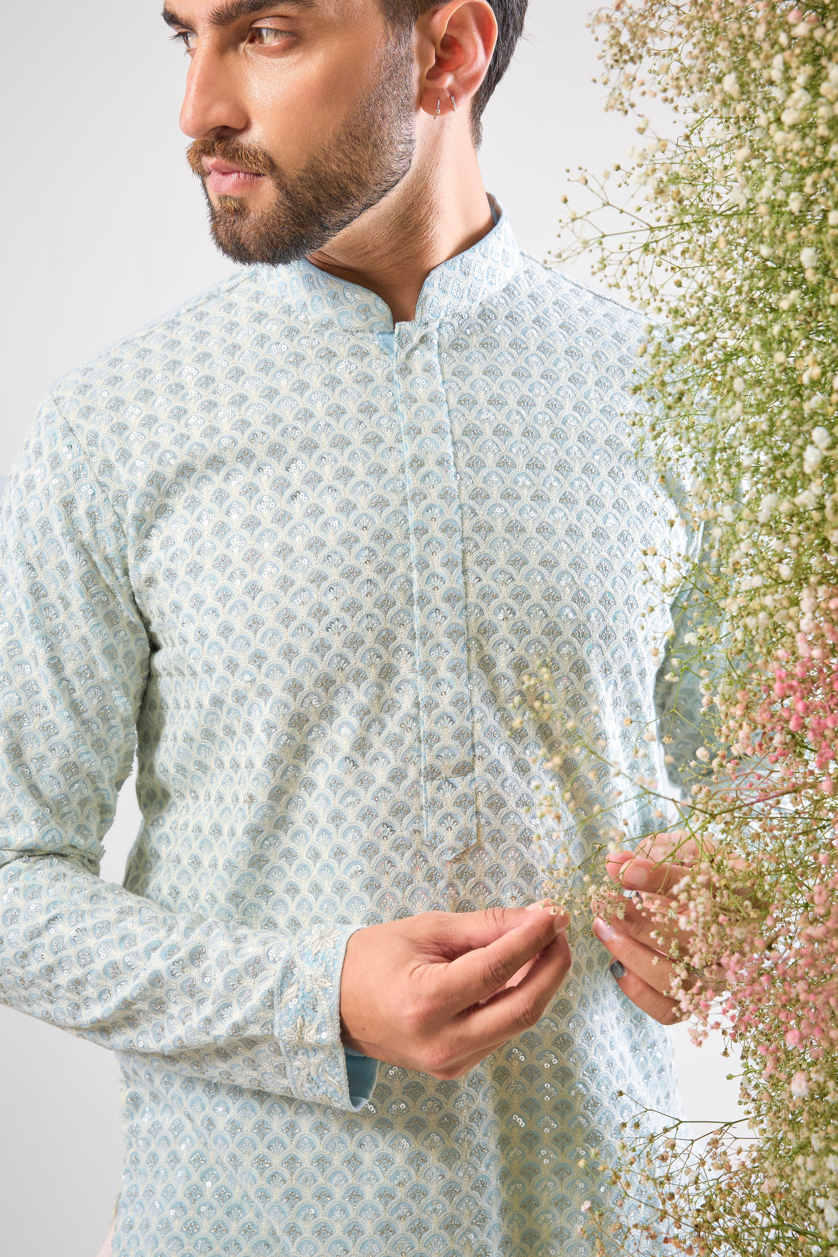 A delicate balance of tradition and dazzle: This Blue Chikankari Short Kurta features exquisite hand-stitched patterns in Cream Thread Work