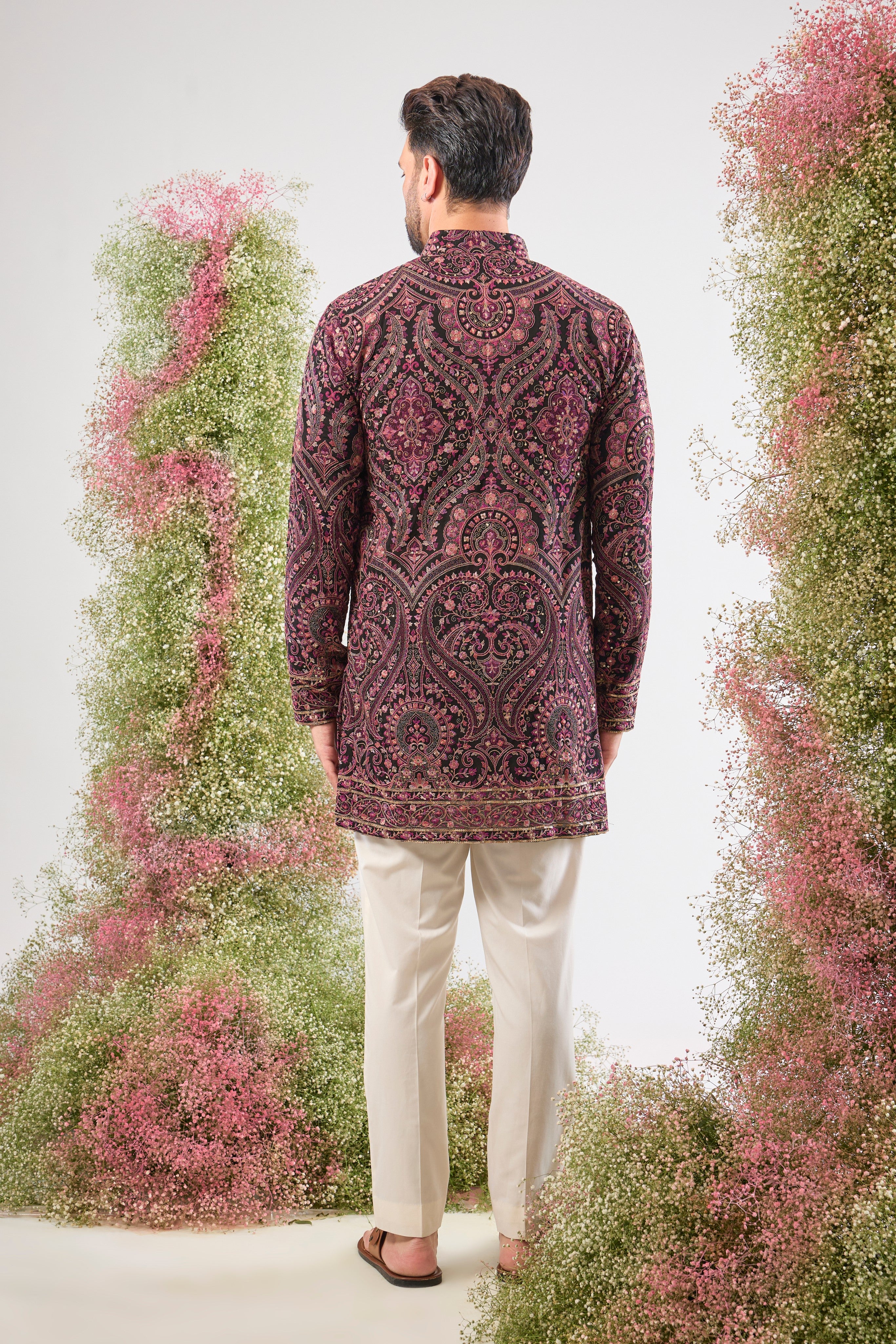 This Black Short Kurta showcases a stunning Jamawar Pattern executed in exquisite, Detailed Multi-threadwork Kashmiri Embroidery. The complex texture and rich detailing make this piece a magnificent fusion of heritage and high fashion.