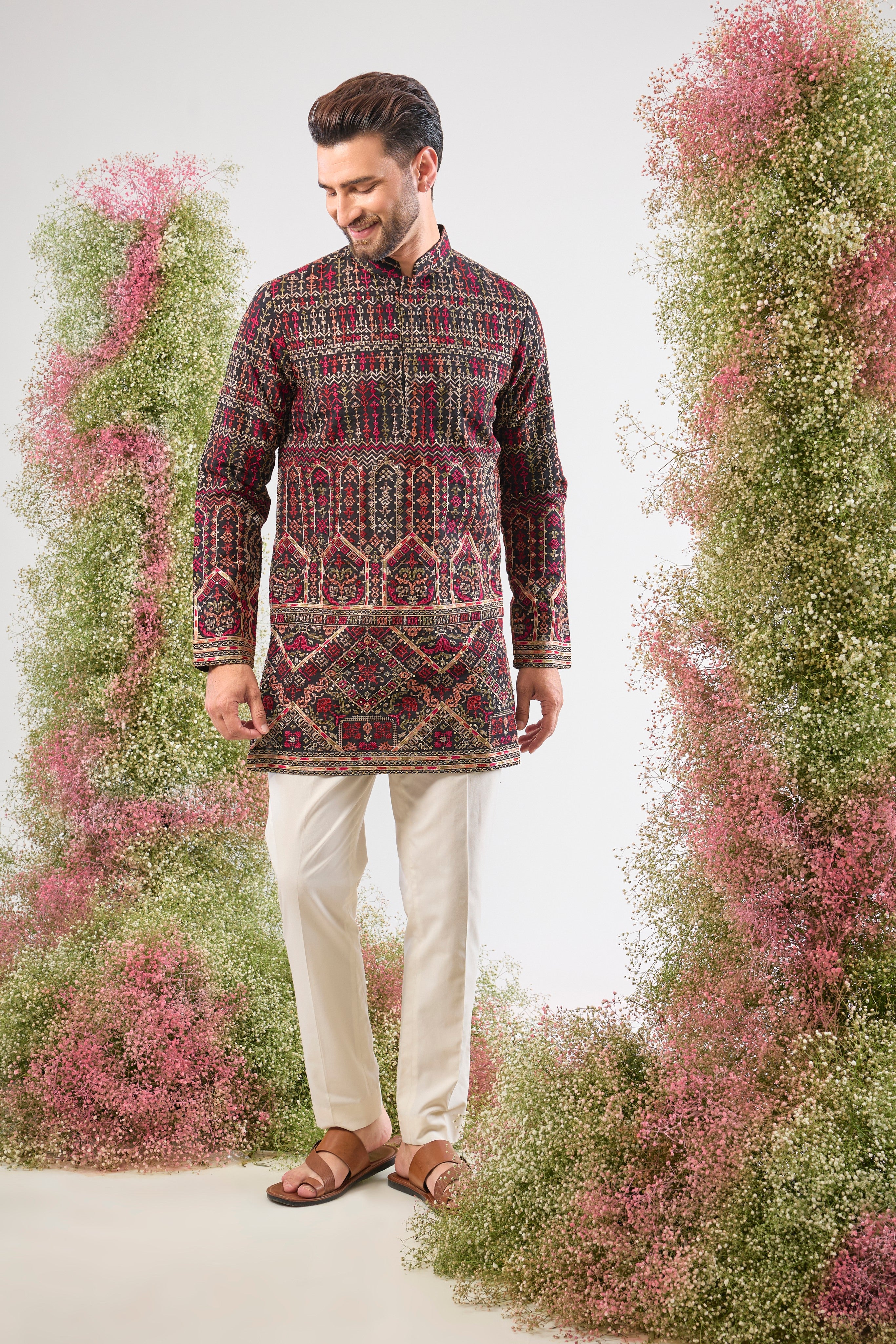 This Short Kurta showcases magnificent Intricate Multi-threadwork Kashmiri Embroidery, creating a beautiful textured surface. The Subtle Sequins are strategically placed to catch the light, ensuring a sophisticated shimmer.