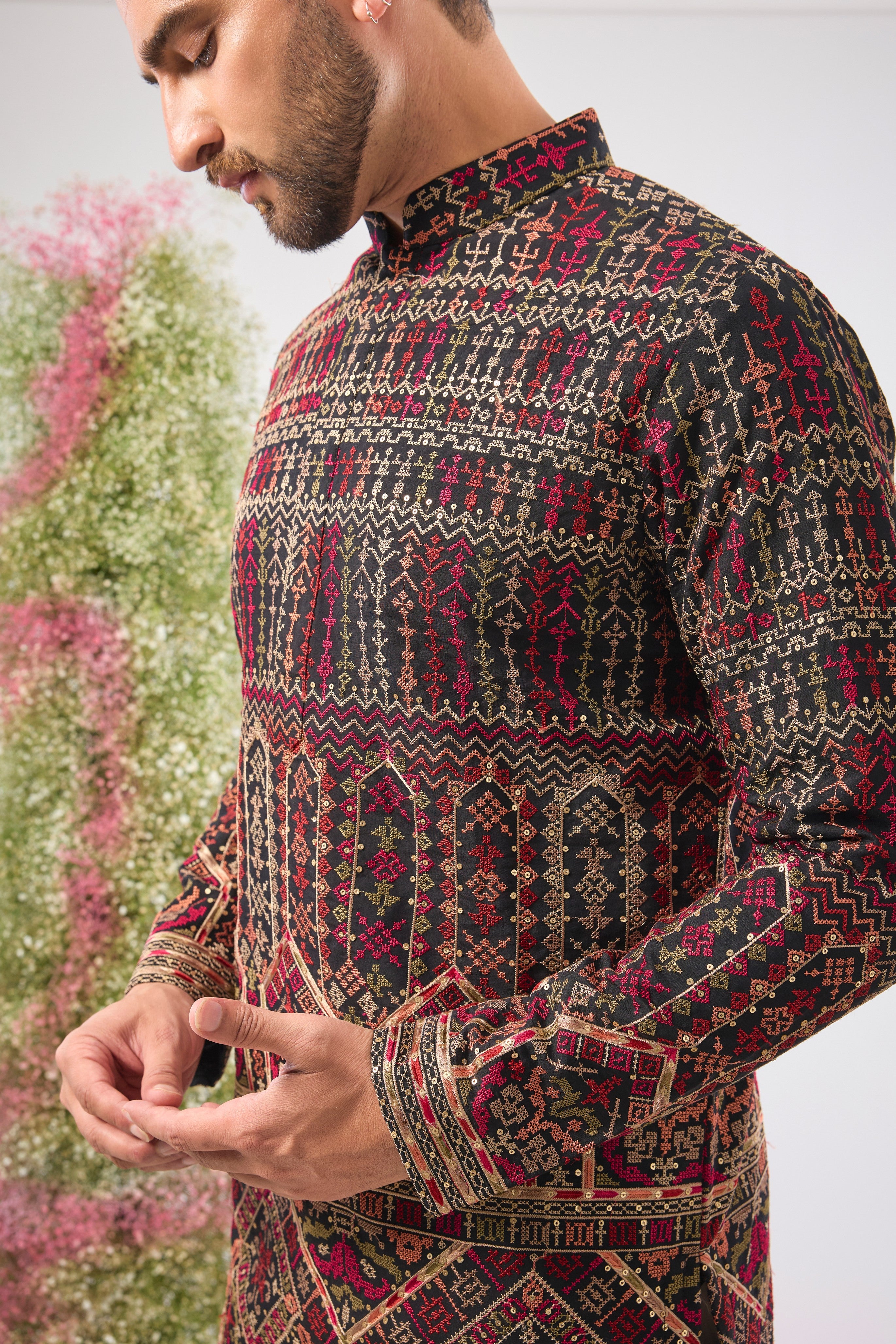 This Short Kurta showcases magnificent Intricate Multi-threadwork Kashmiri Embroidery, creating a beautiful textured surface. The Subtle Sequins are strategically placed to catch the light, ensuring a sophisticated shimmer.