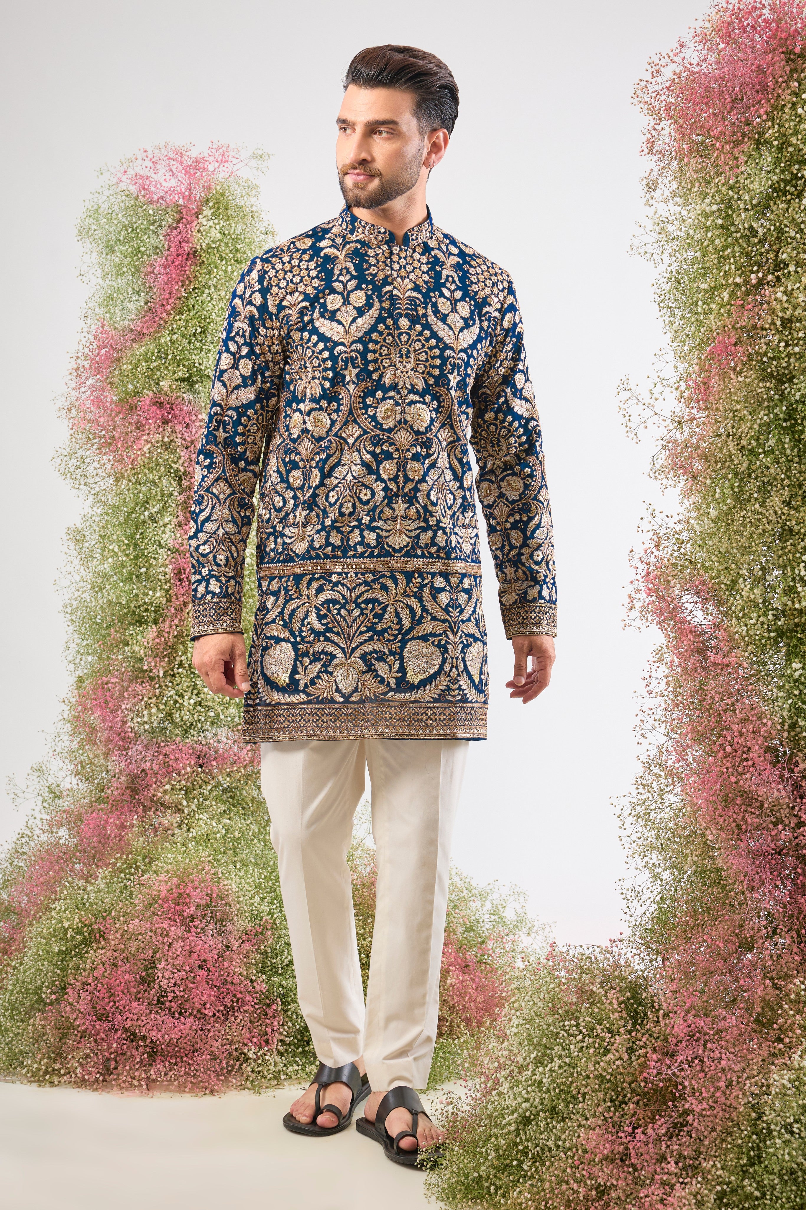 Experience the commanding grandeur of Royal Blue. This Hot Seller Short Kurta is adorned with opulent Heavy Zari Work, intricate Detailed Sequin and Floral Embroidery,