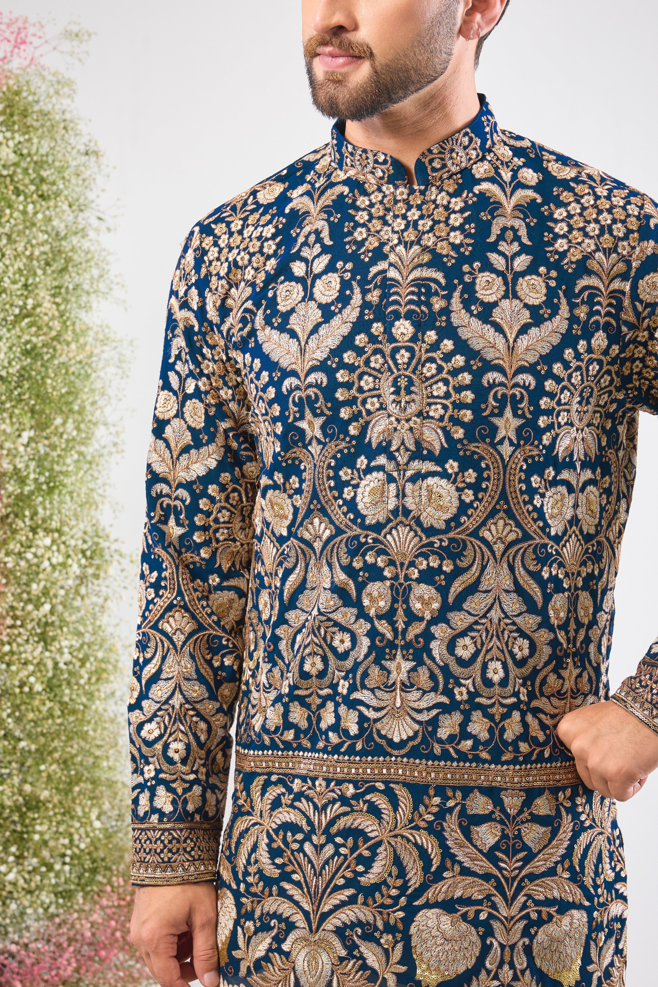 Experience the commanding grandeur of Royal Blue. This Hot Seller Short Kurta is adorned with opulent Heavy Zari Work, intricate Detailed Sequin and Floral Embroidery,