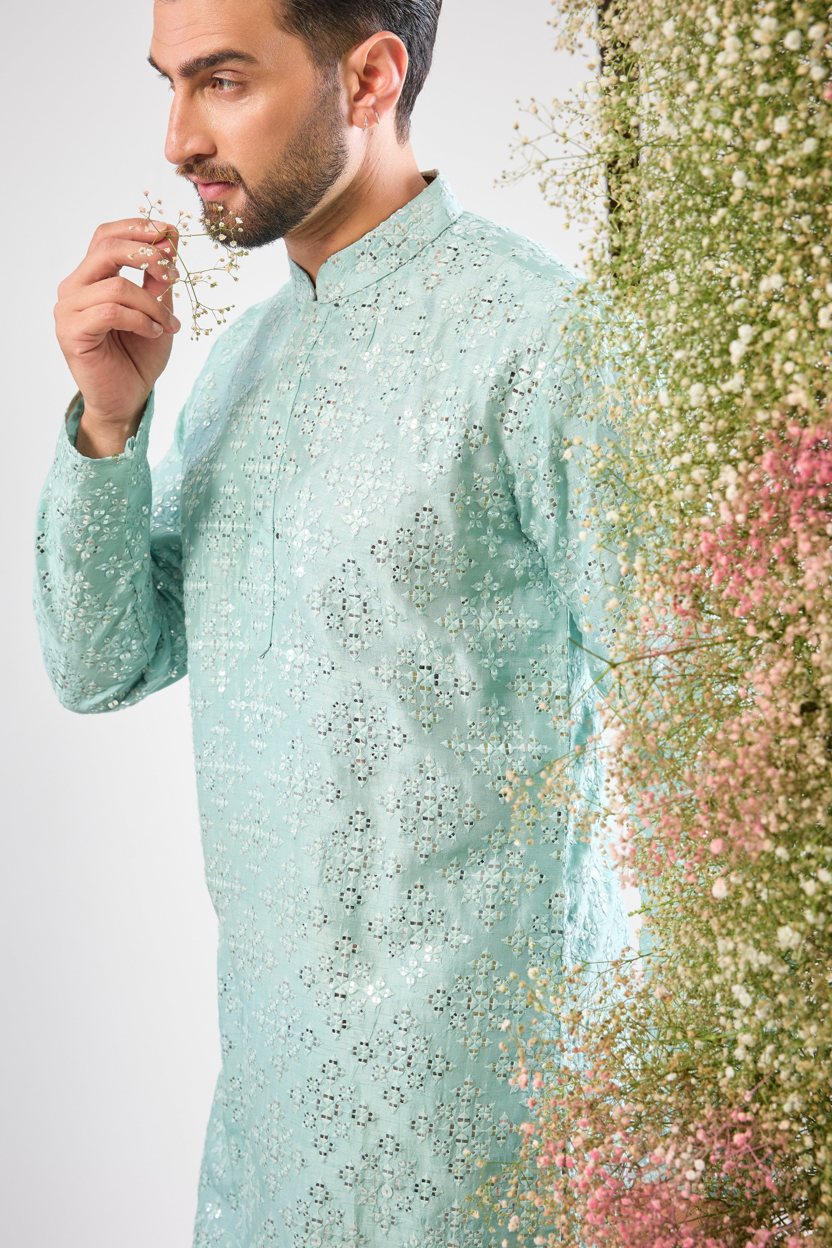 This Blue Mirror Work Long Kurta showcases dense Heavy Thread Work layered with spectacular Detailed Heavy Sequin Work, providing unmatched richness and sparkle across the long silhouette.