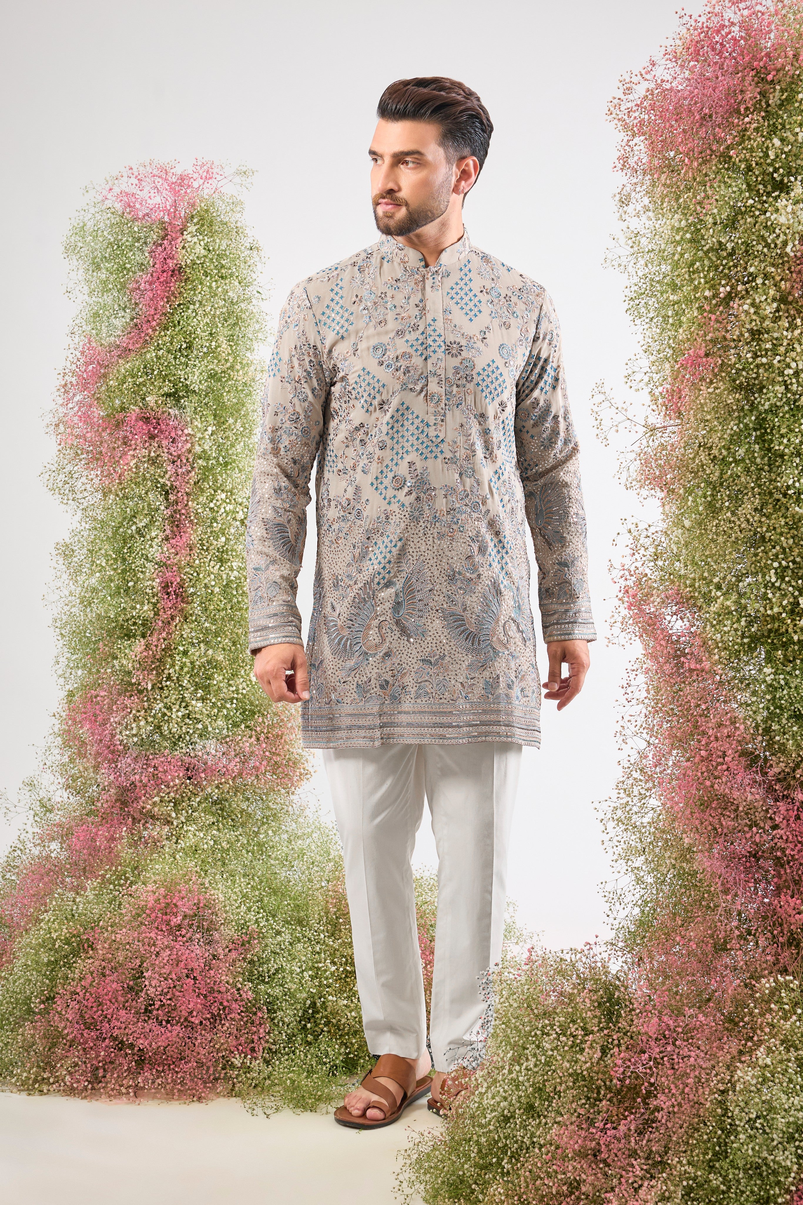 A symphony of neutral tones and detailed craft. This Nude Short Chikankari Kurta features