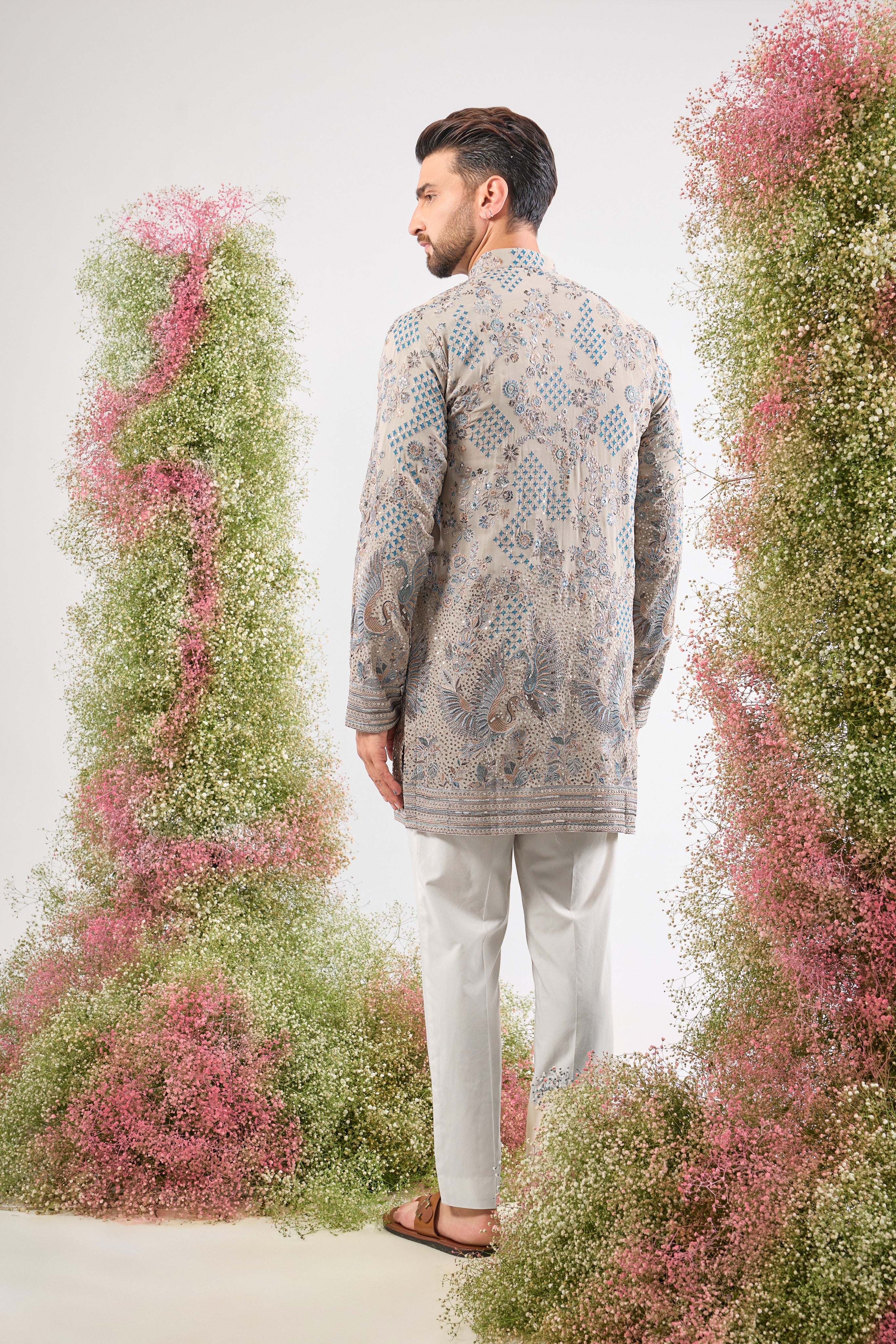 A symphony of neutral tones and detailed craft. This Nude Short Chikankari Kurta features