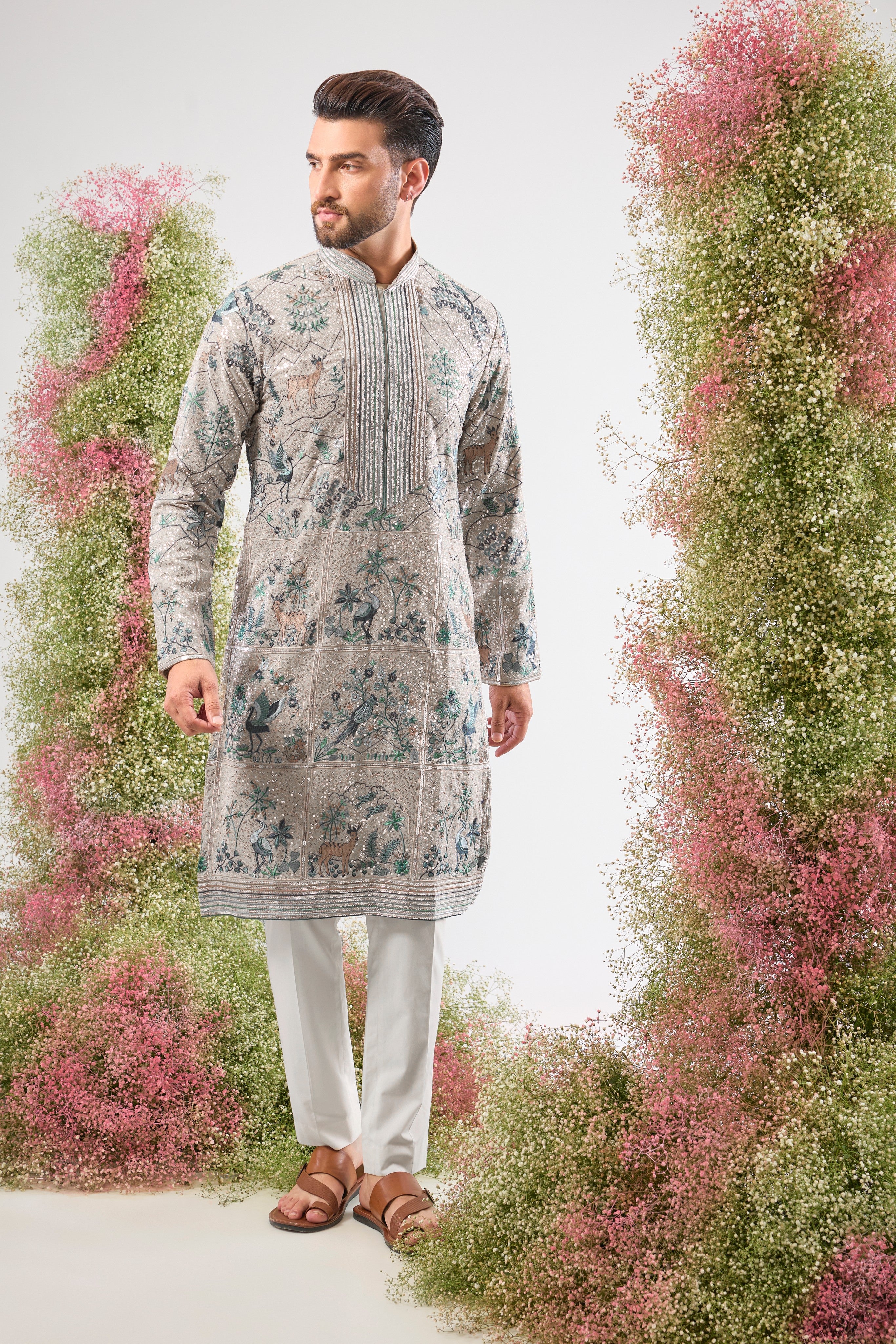 Our Full Sequined Kurta features exquisite Intricate Flora and Fauna Embroidery and a sophisticated Detailed Neckline. Simply stunning glamour.