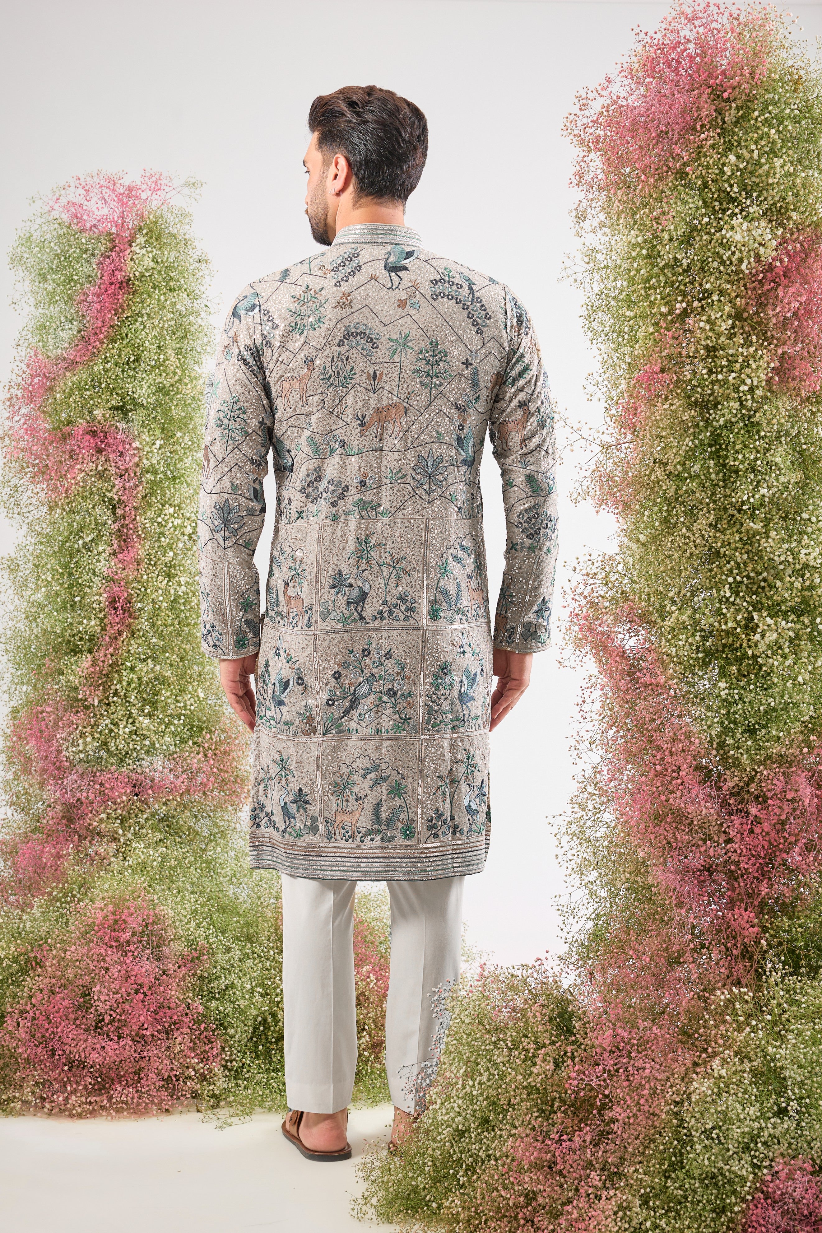 Our Full Sequined Kurta features exquisite Intricate Flora and Fauna Embroidery and a sophisticated Detailed Neckline. Simply stunning glamour.