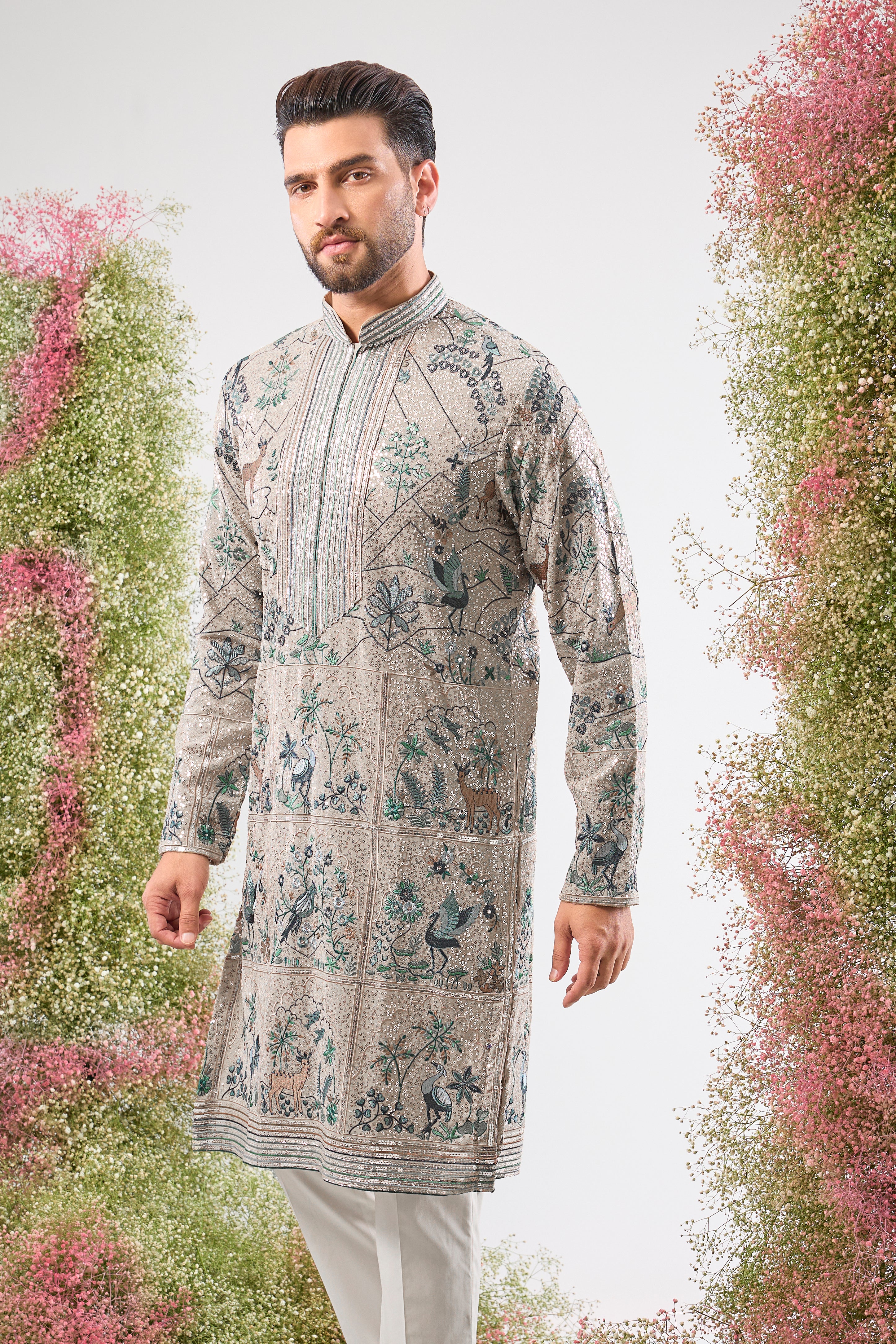 Our Full Sequined Kurta features exquisite Intricate Flora and Fauna Embroidery and a sophisticated Detailed Neckline. Simply stunning glamour.