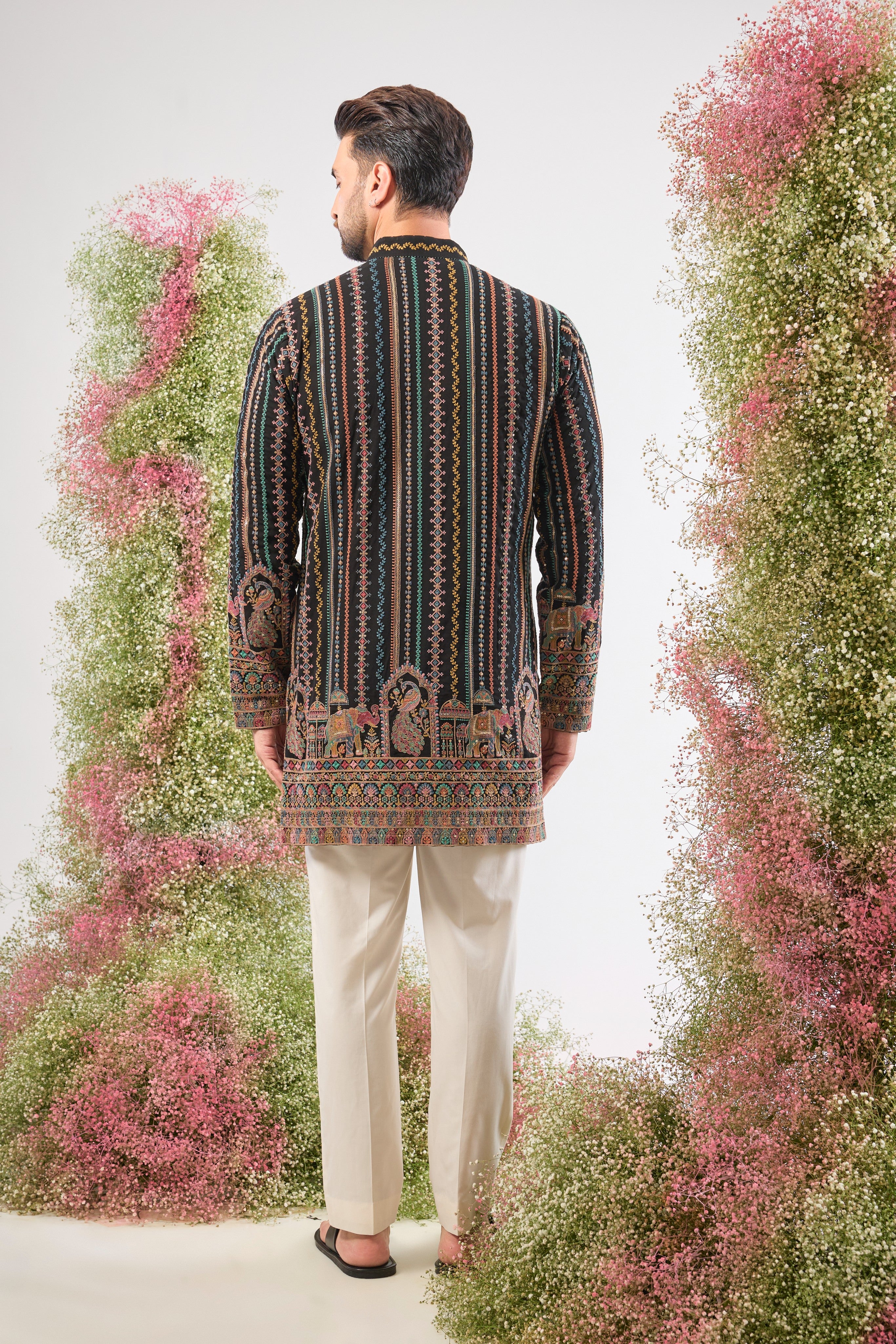 This Multi-coloured Short Kurta showcases a striking contrast between structured Detailed Thread Work Stripes and organic, l