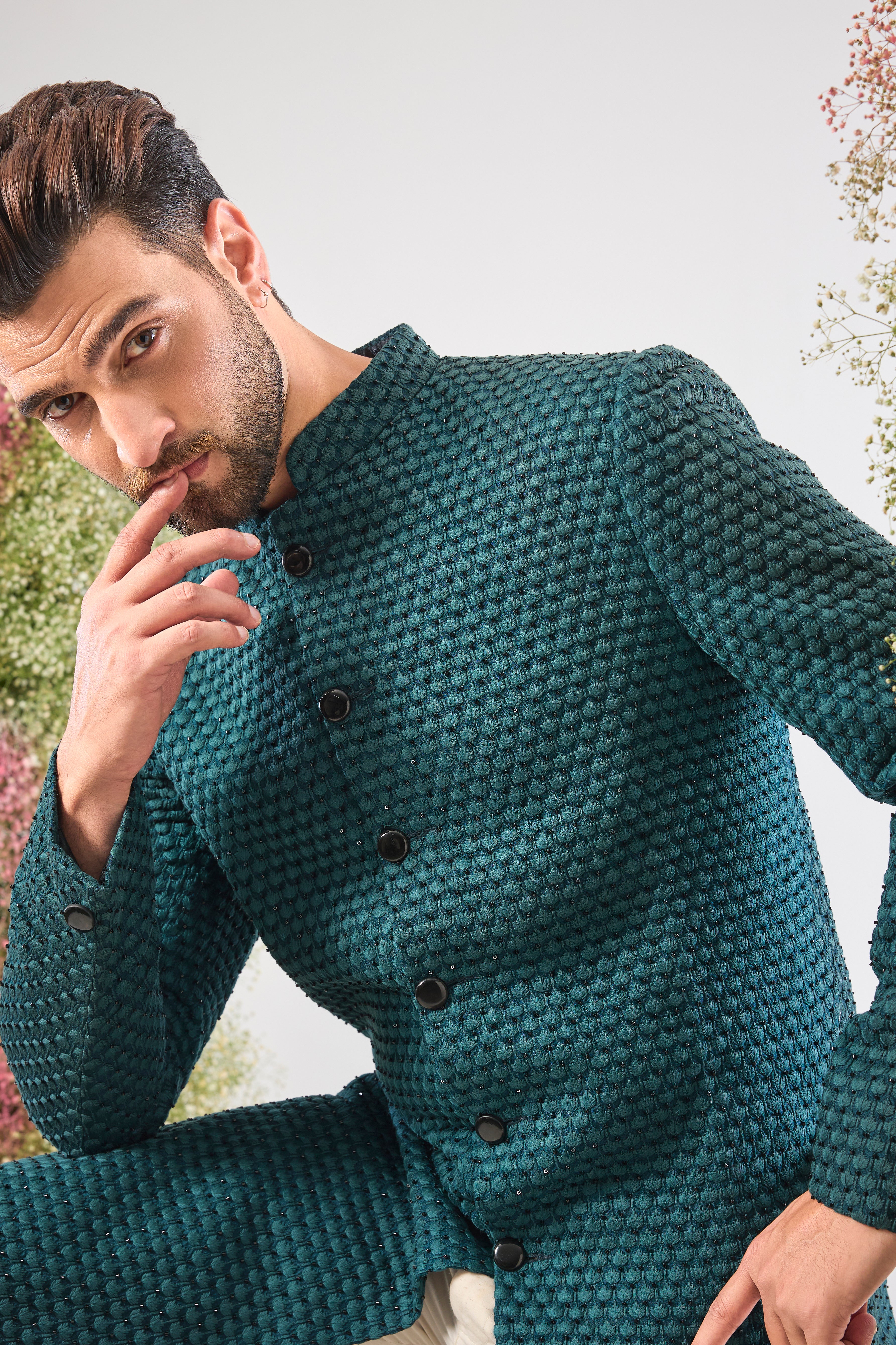 This Sherwani is lavishly detailed with Heavy Thread Work layered with the striking contrast of Black Cut Dana, offering both depth and subtle sparkle.