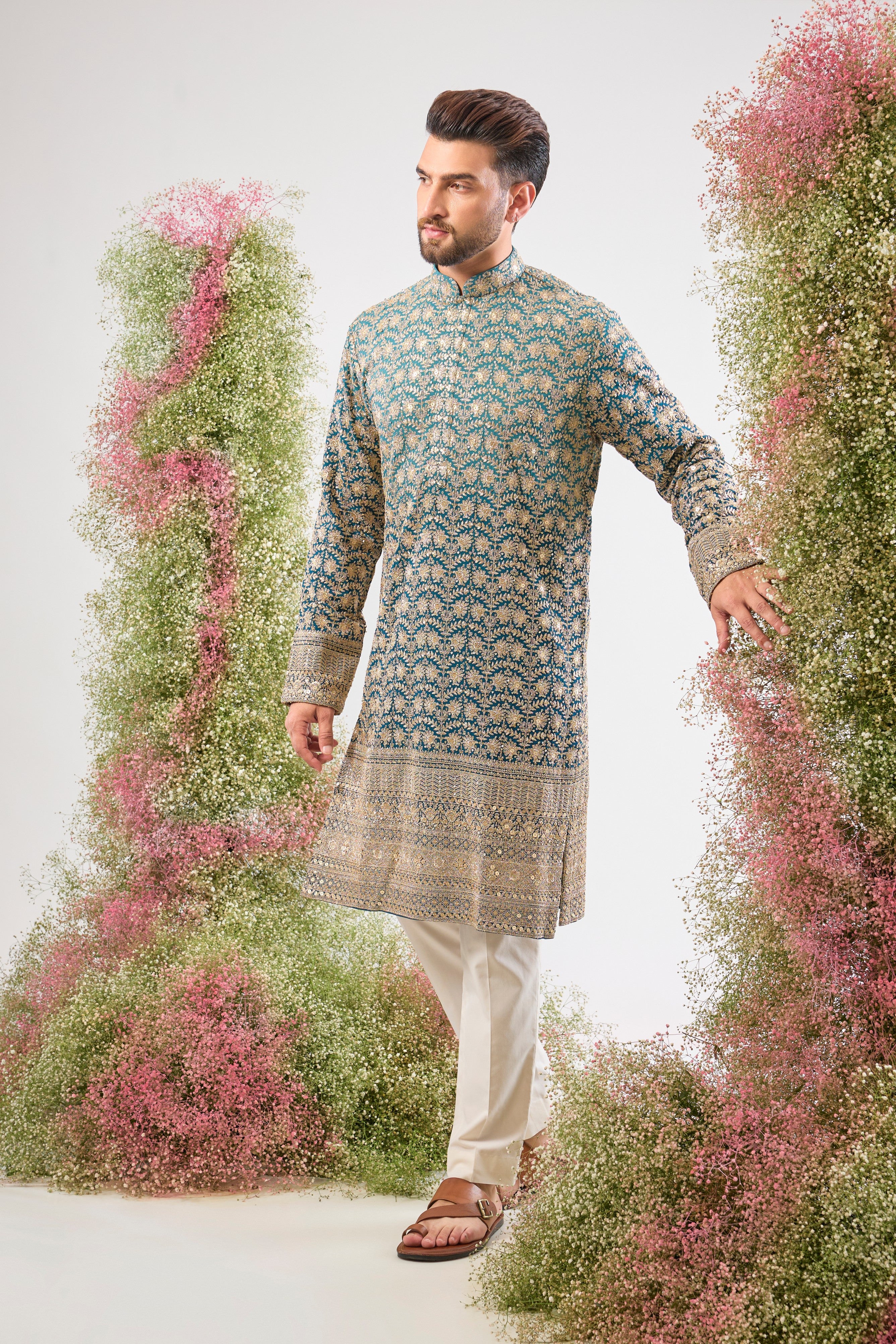 his super classy Blue Ombre Shaded Long Kurta showcases a breathtaking gradient effect and is richly adorned with Heavy Zari and Sequin Work. The fluid design and intricate shimmer make this a truly modern heirloom