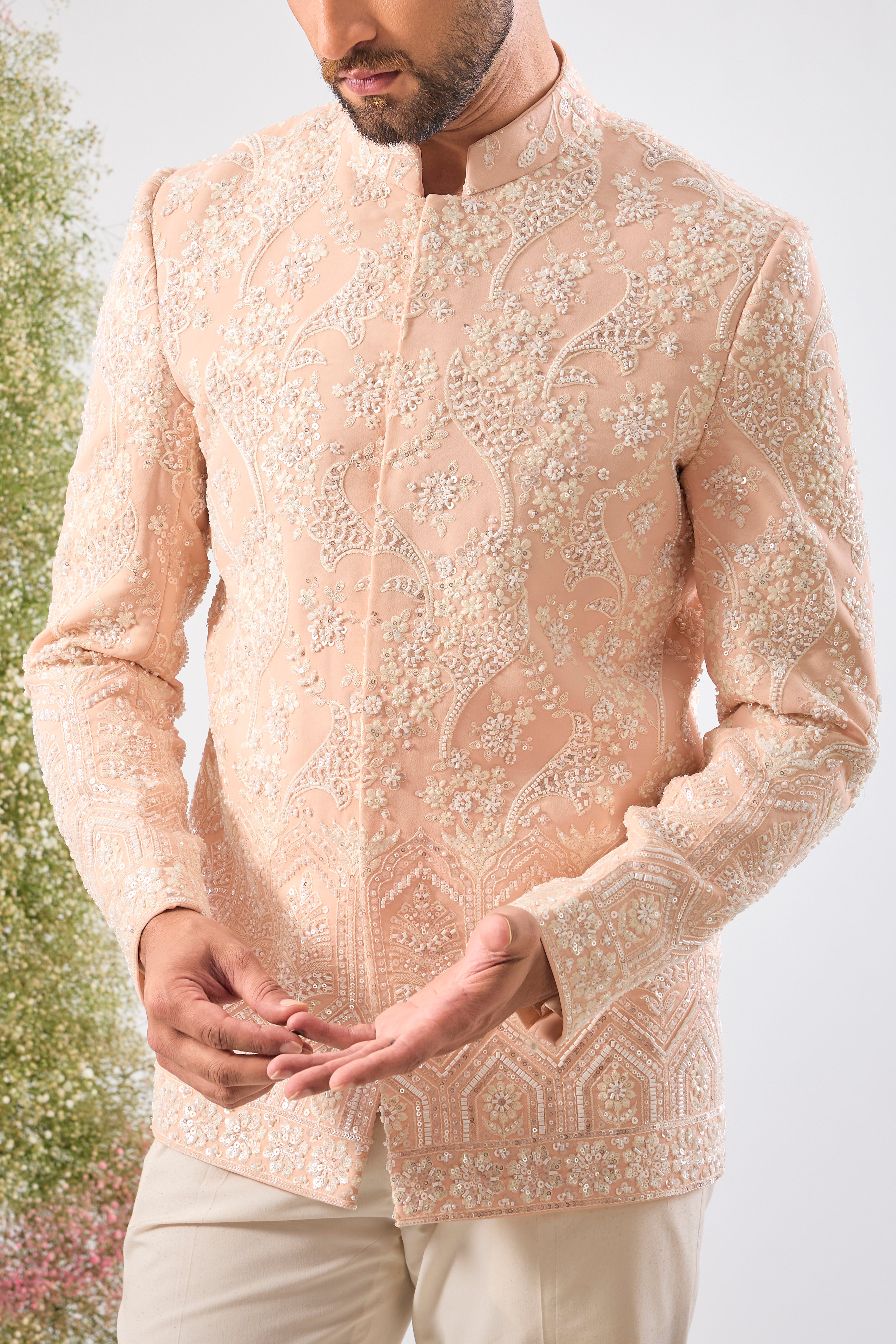 This Hand Embroidered Bandhgala features rich, textural detail where Intricate Floral Embroidery is lavishly decorated with brilliant White Cut Dana and Sequins.