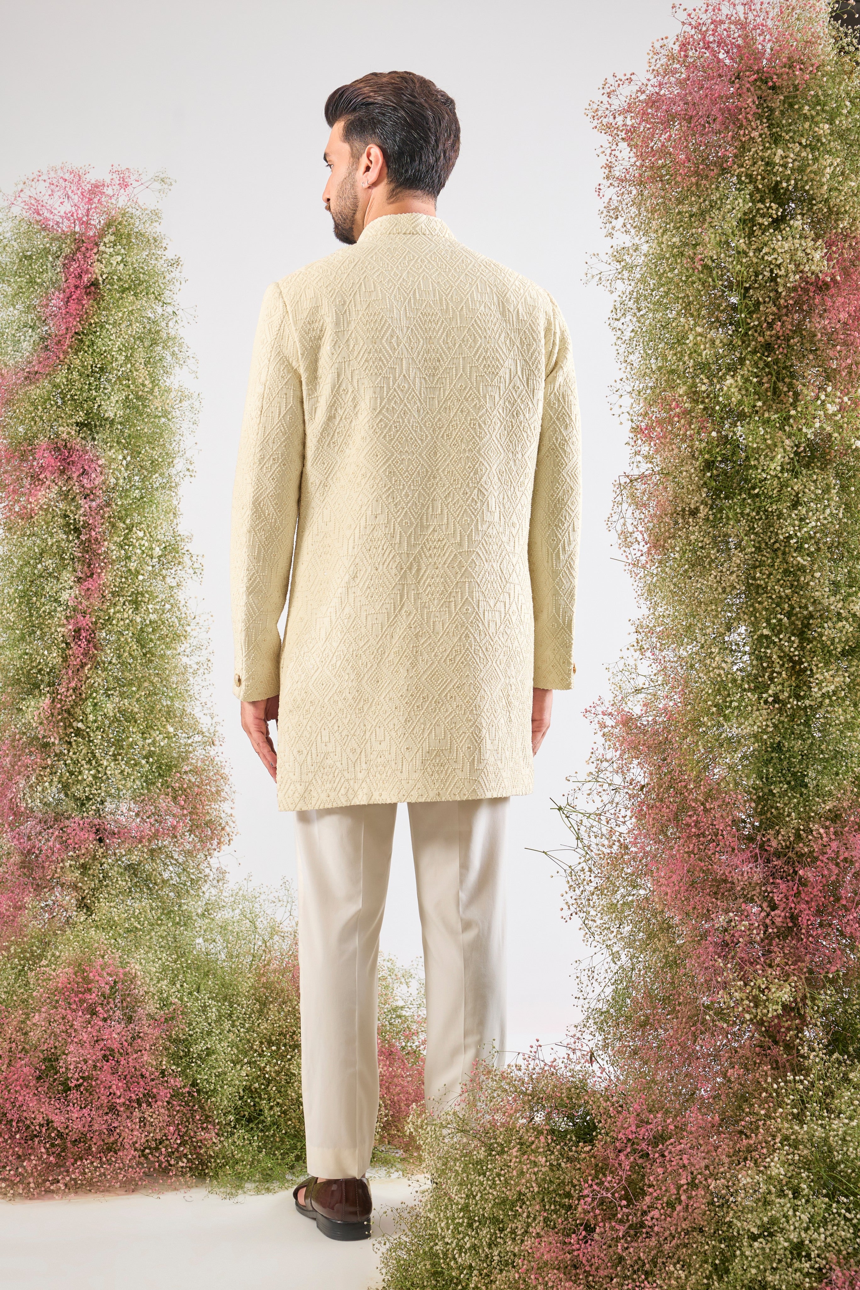 This Short Sherwani showcases intense Heavy Thread Work in a mesmerizing Geometrical Pattern, creating unparalleled texture and depth.