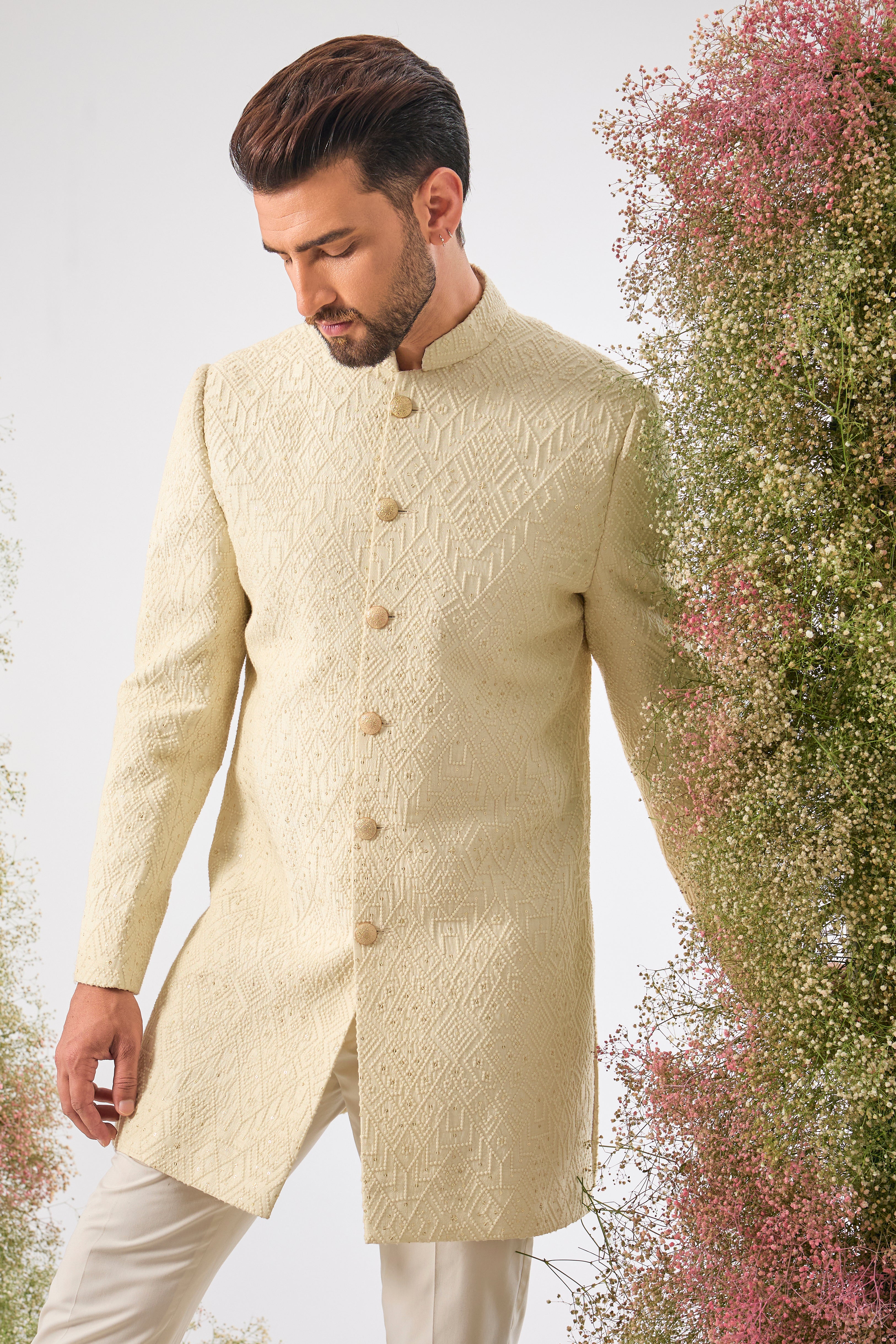 This Short Sherwani showcases intense Heavy Thread Work in a mesmerizing Geometrical Pattern, creating unparalleled texture and depth.