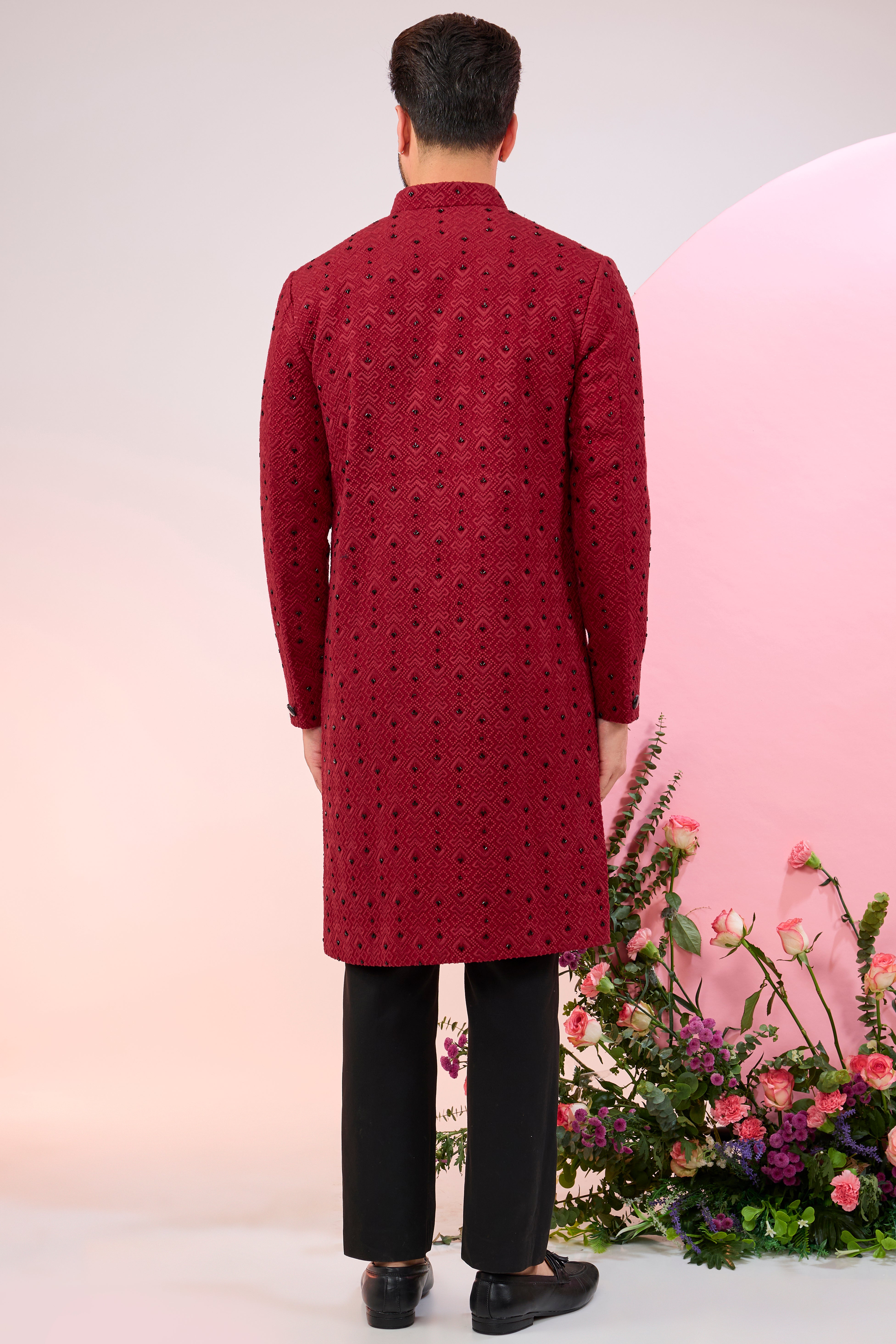 red geometrically embridred sherwani with black cutdana