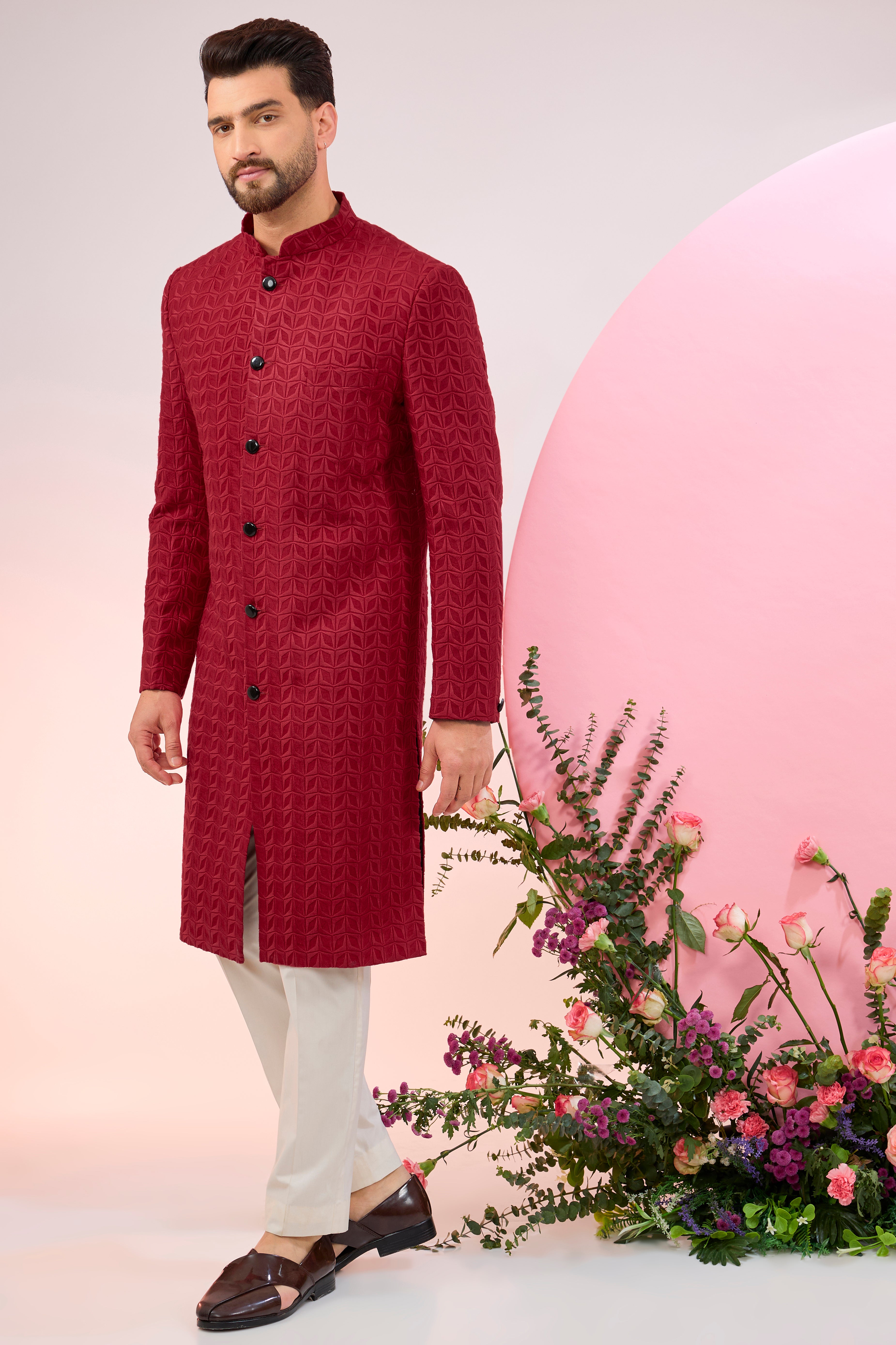 Red thread work sherwani.