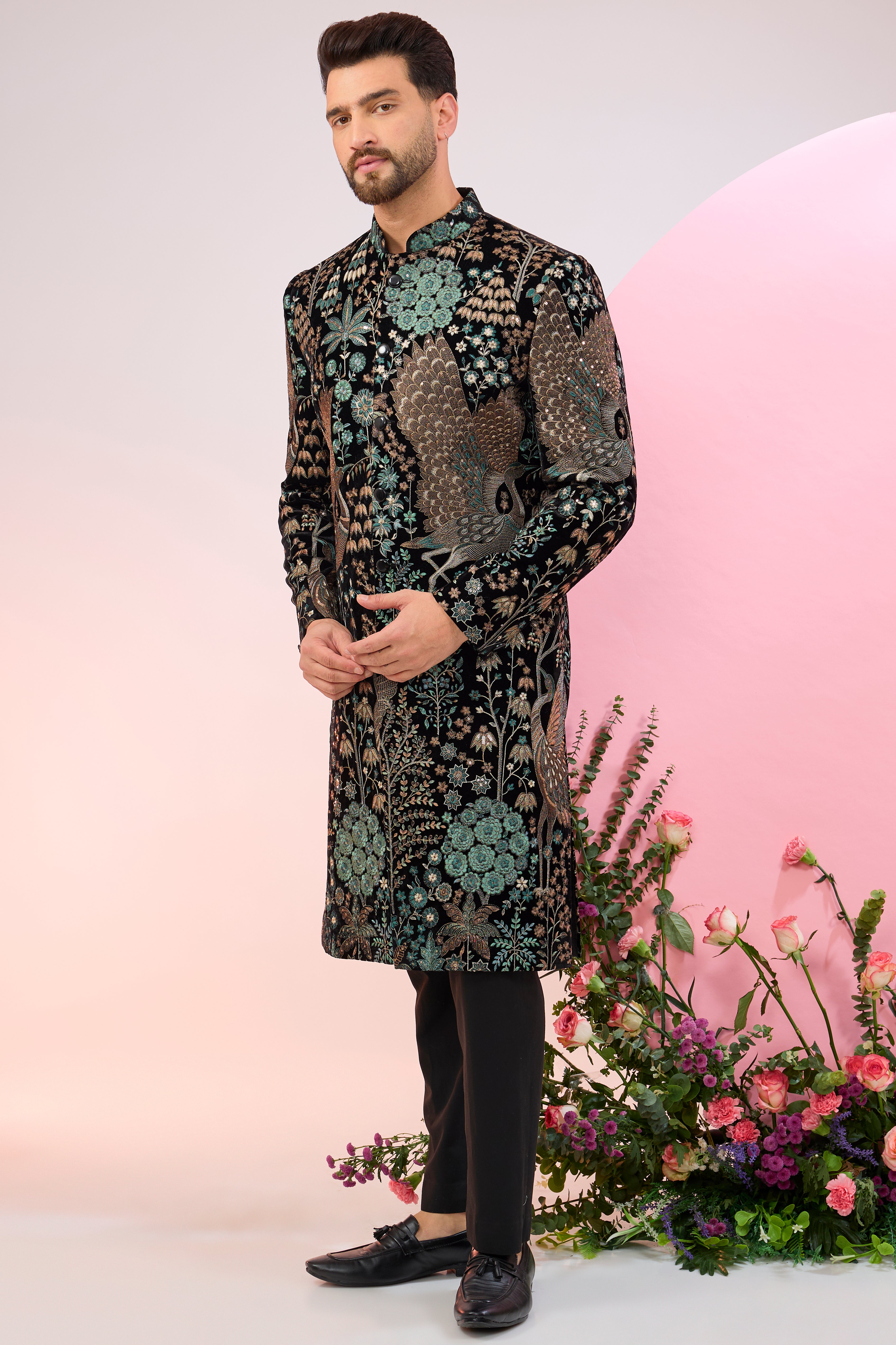 black sherwani with intricate floral and fauna embroidery