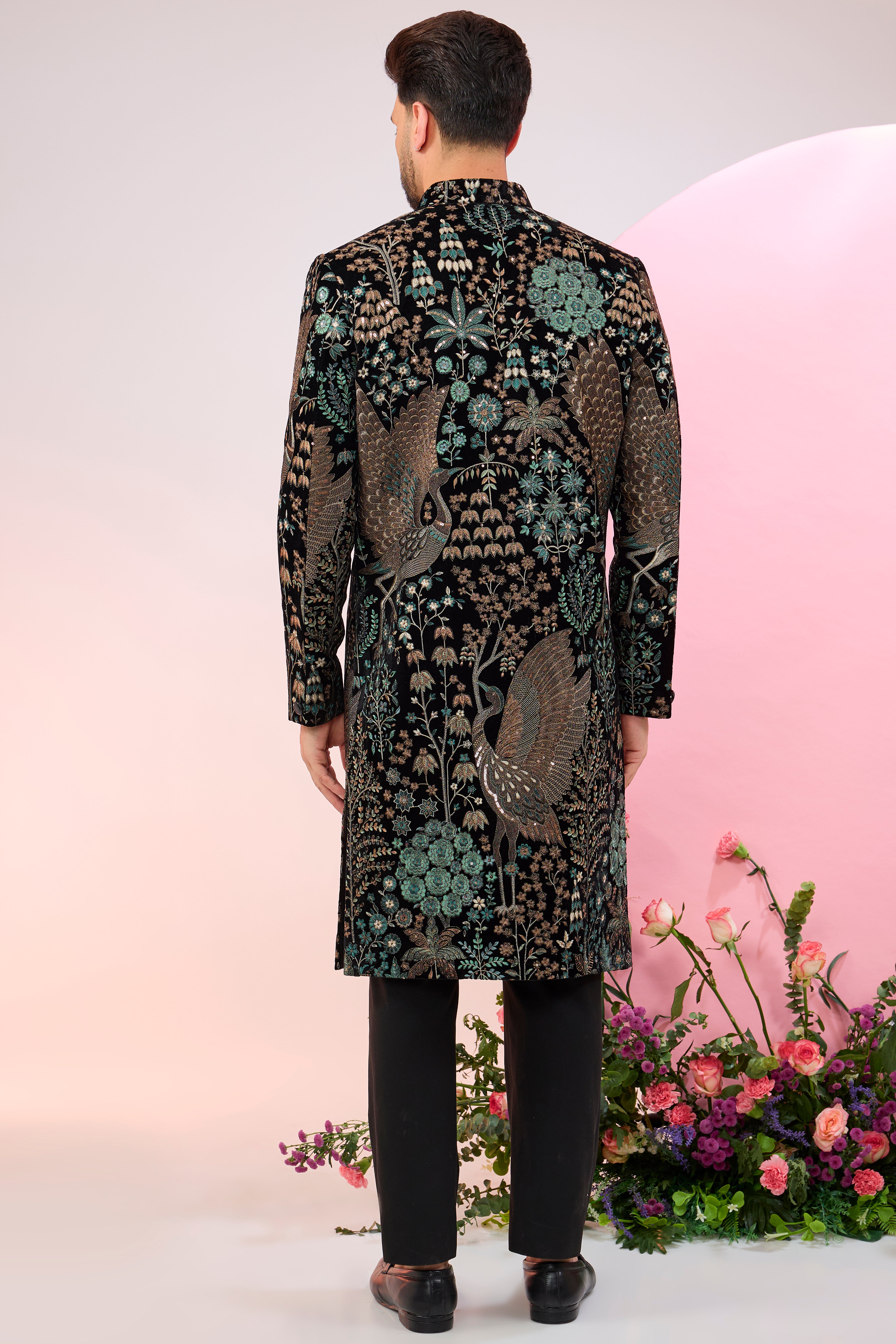 black sherwani with intricate floral and fauna embroidery