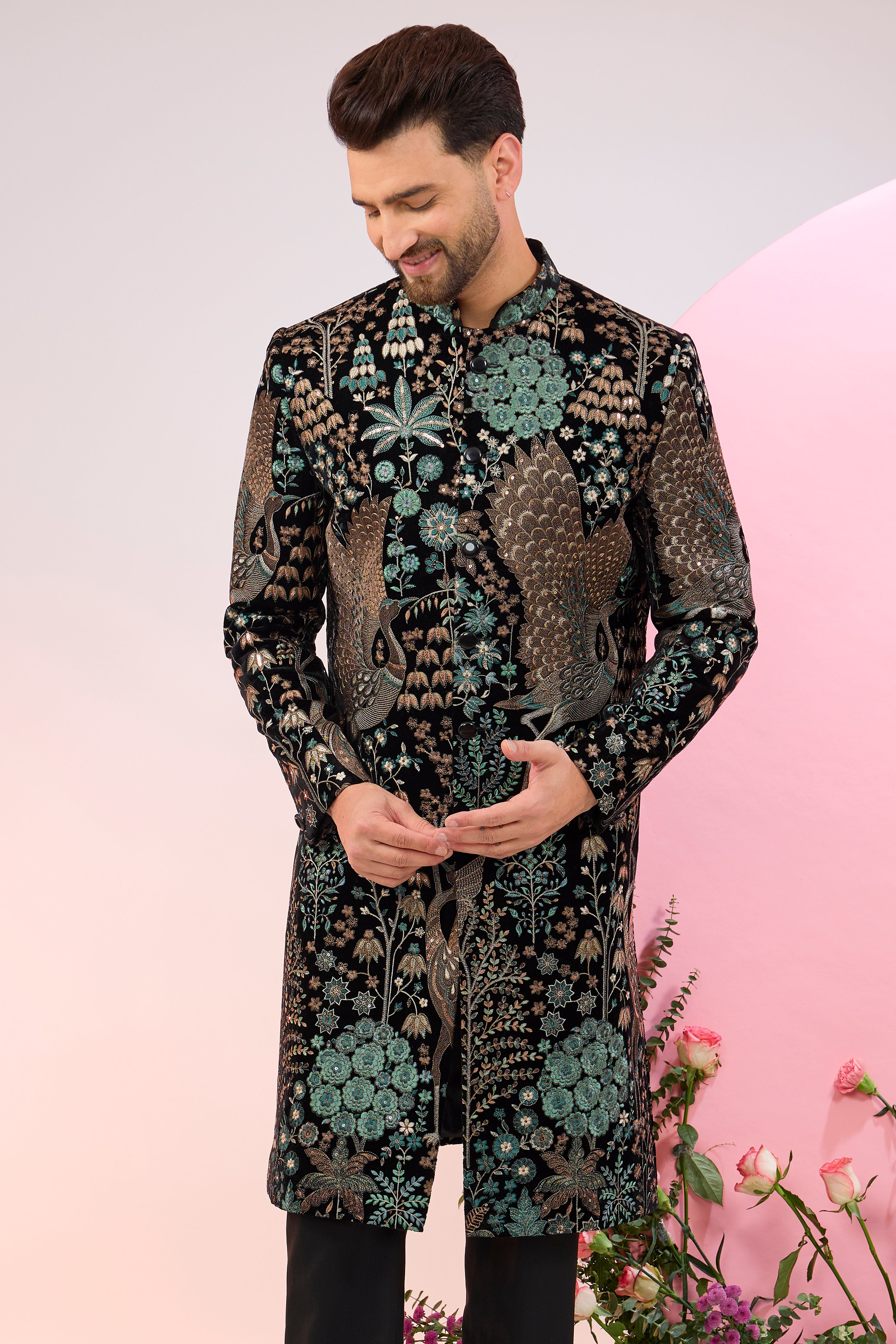 black sherwani with intricate floral and fauna embroidery