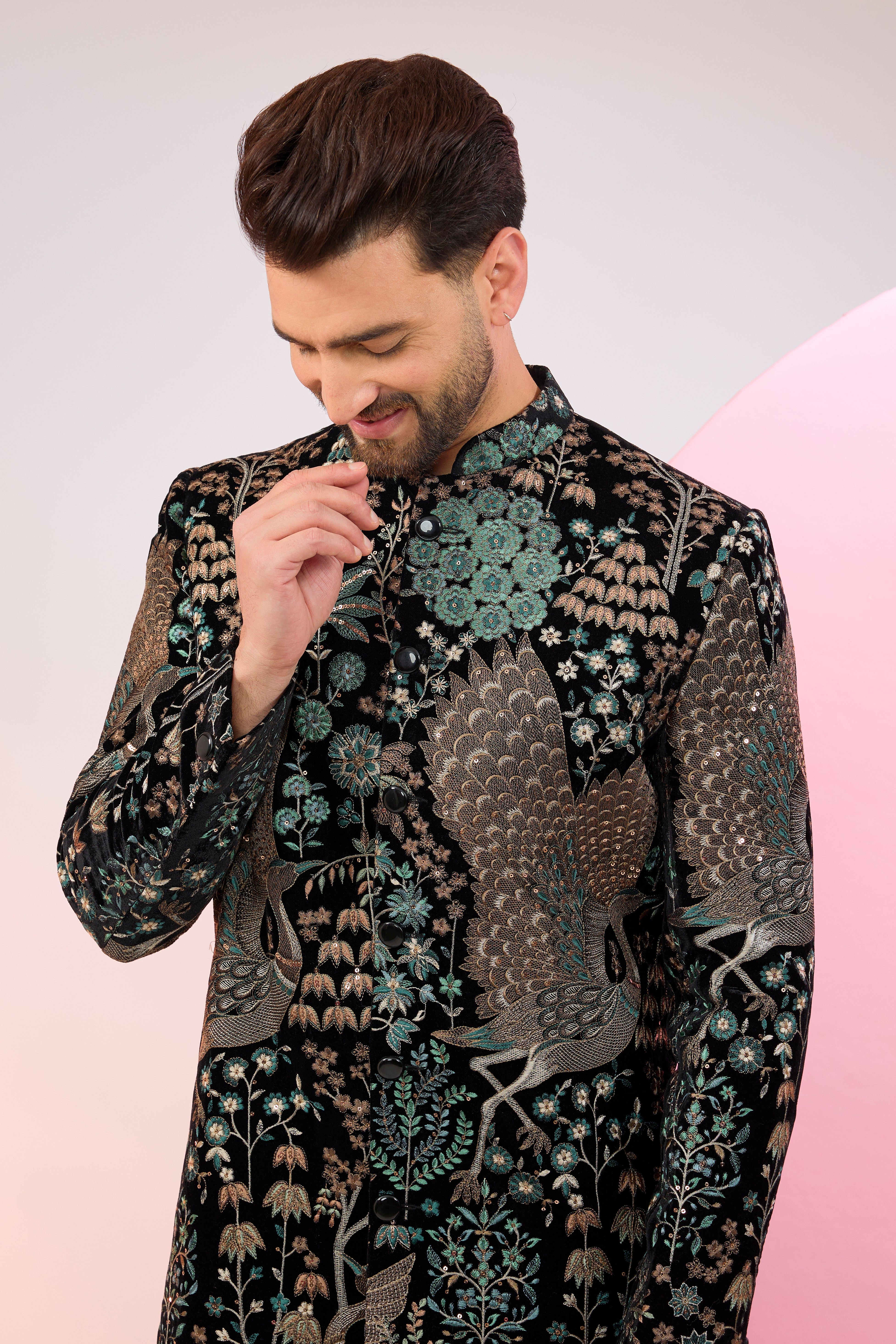 black sherwani with intricate floral and fauna embroidery