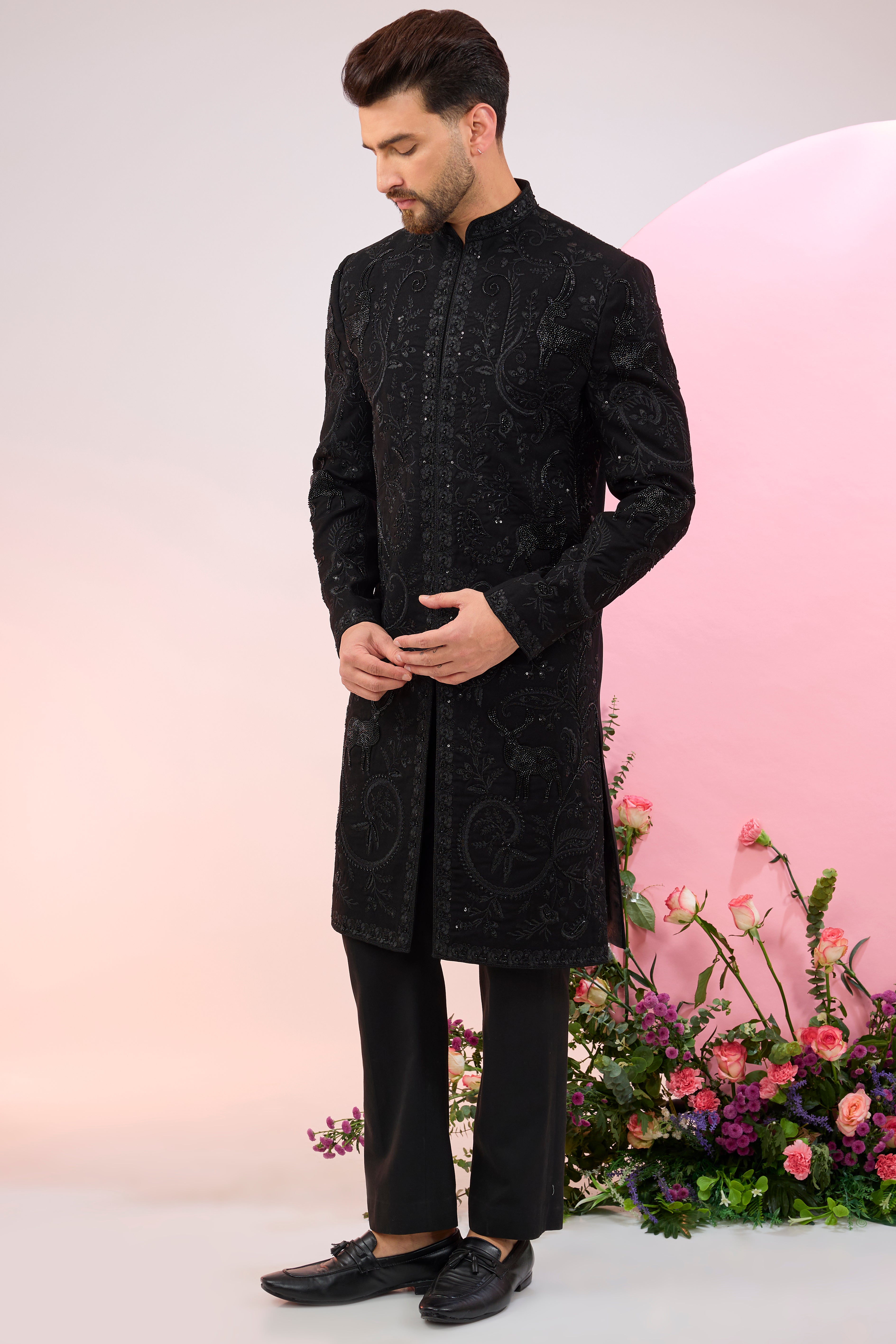 Black hand embroidered cut dana sherwani with flora and fauna motifs.