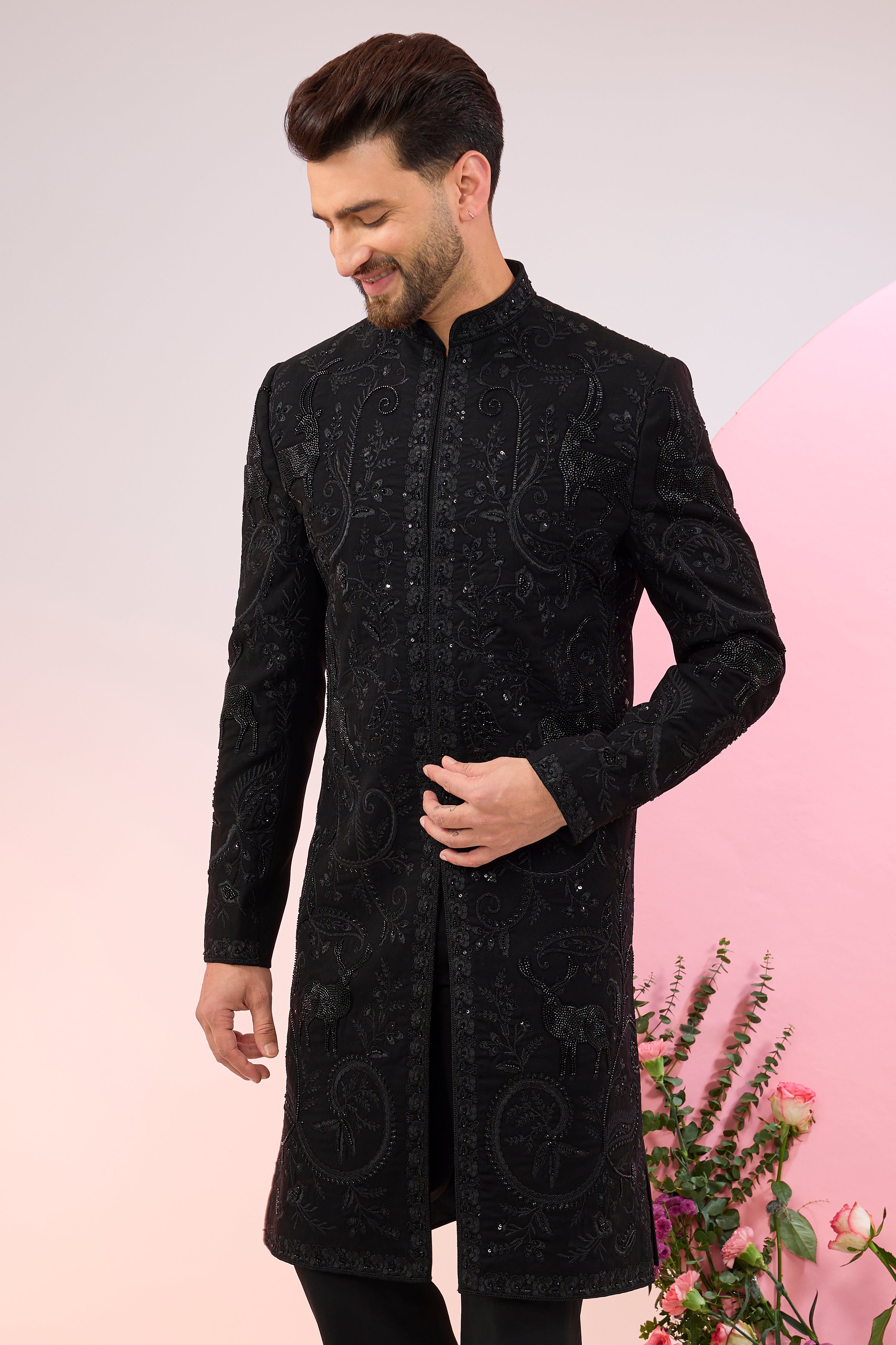 Black hand embroidered cut dana sherwani with flora and fauna motifs.