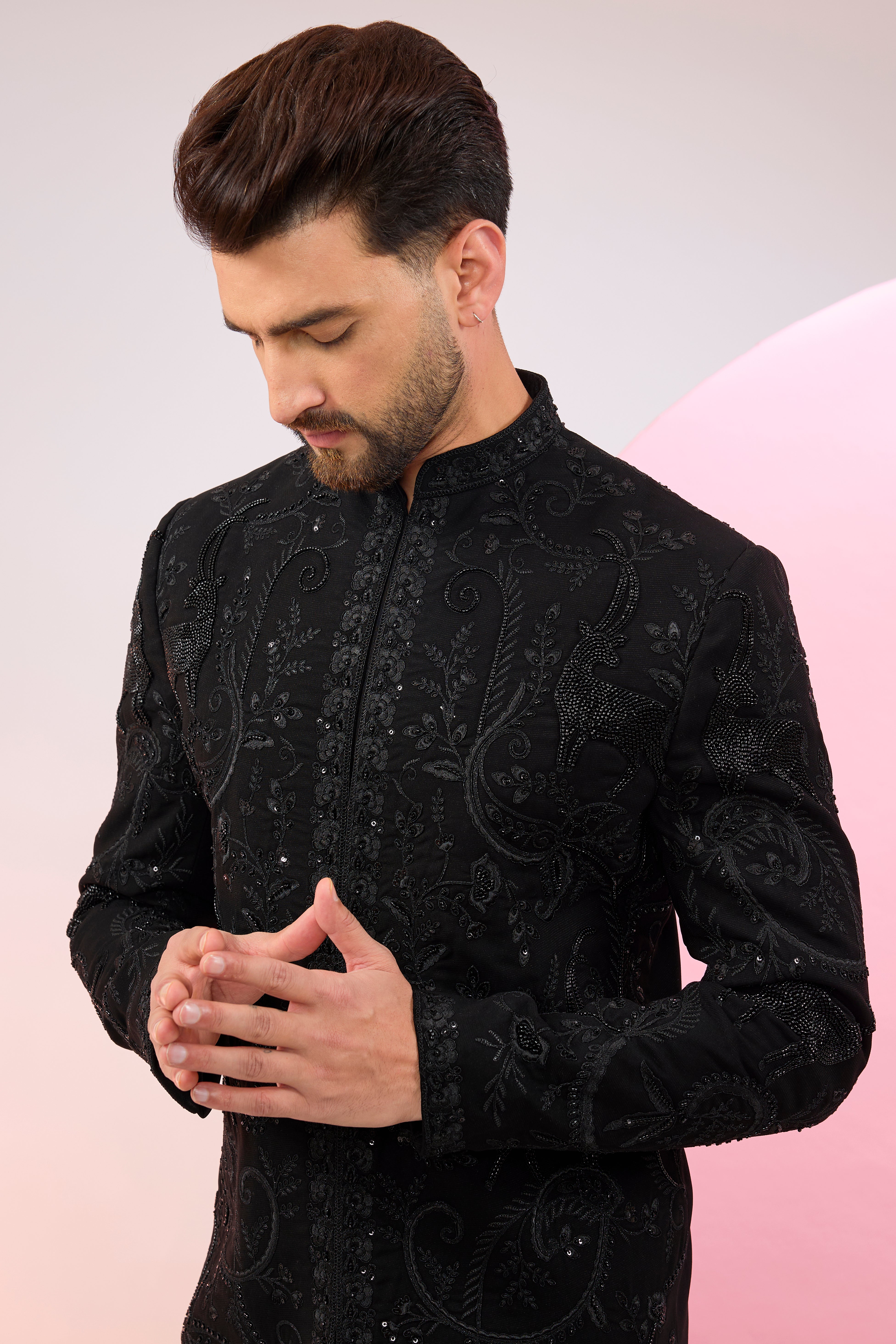 Black hand embroidered cut dana sherwani with flora and fauna motifs.