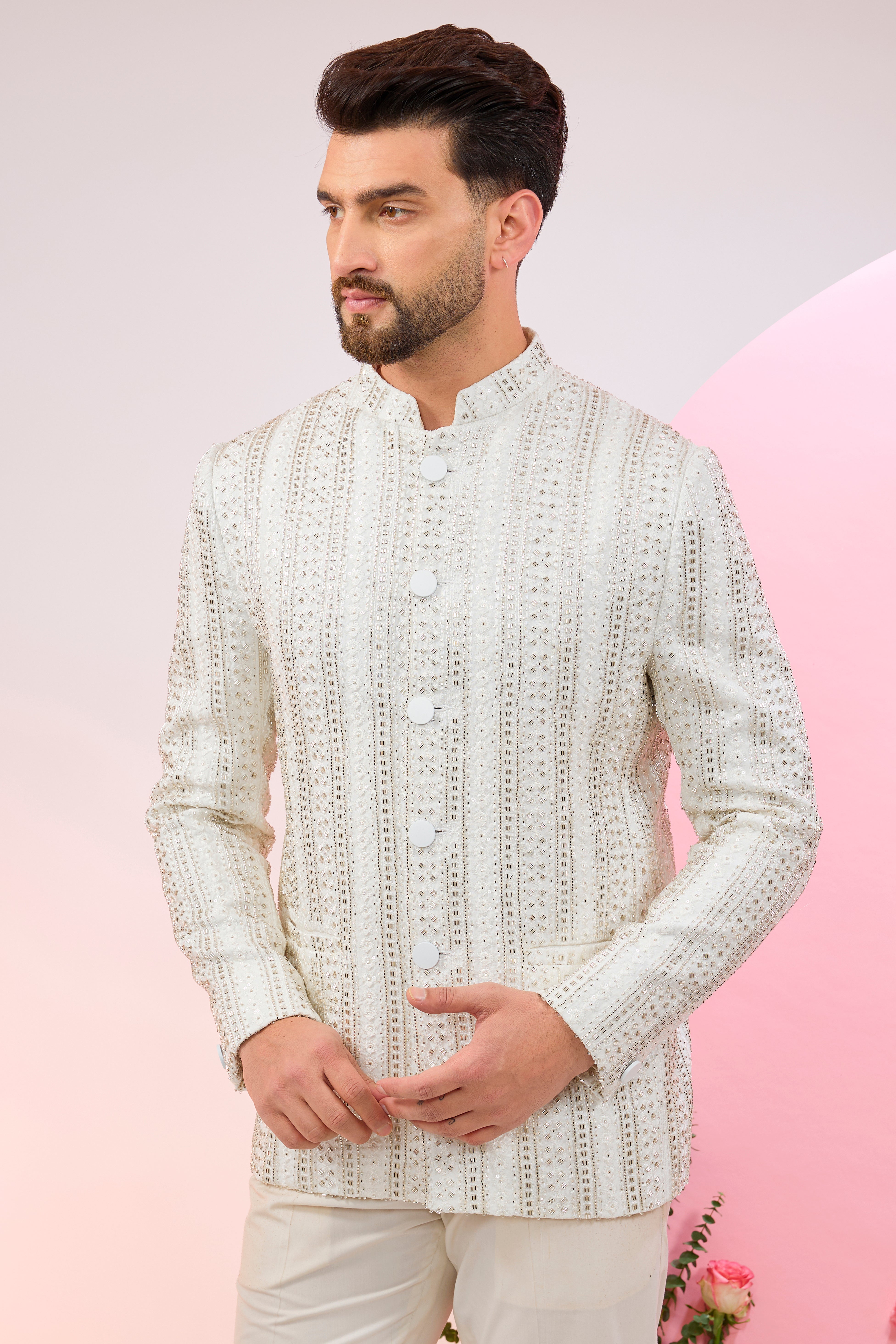 white bandhgala with heavy cut-dana embroidery.