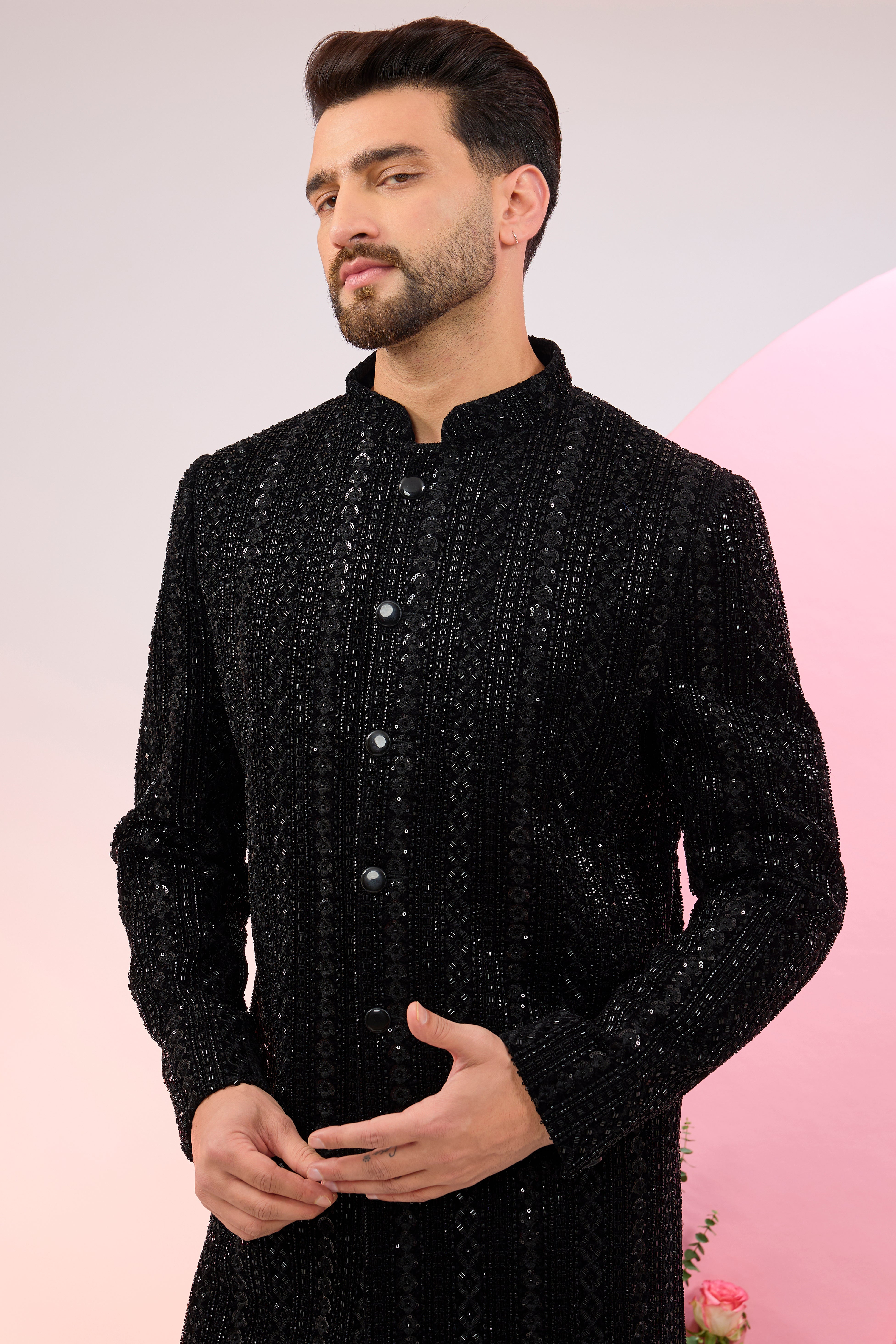 Black sherwani with heavy cut-dana embroidery.