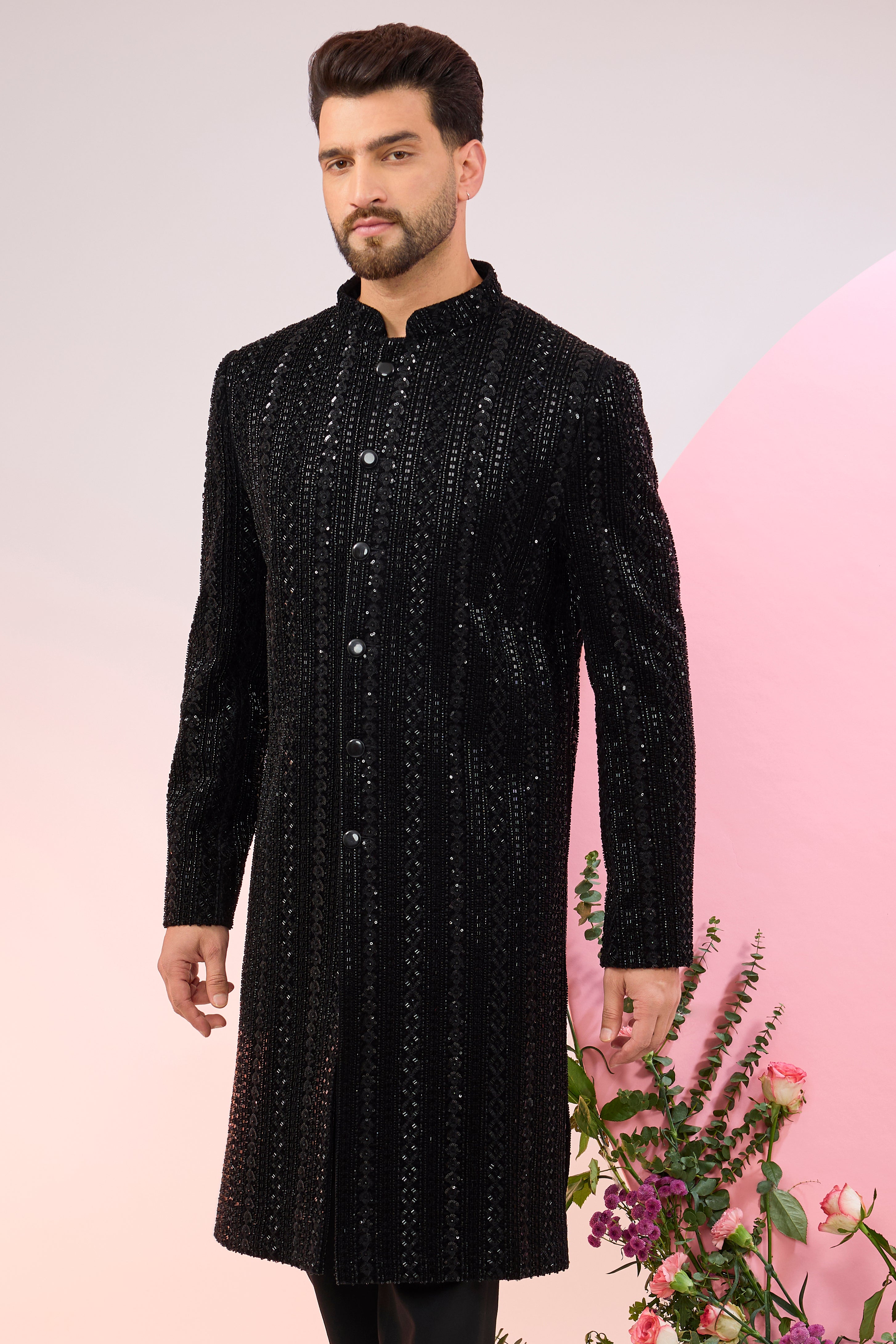 Black sherwani with heavy cut-dana embroidery.