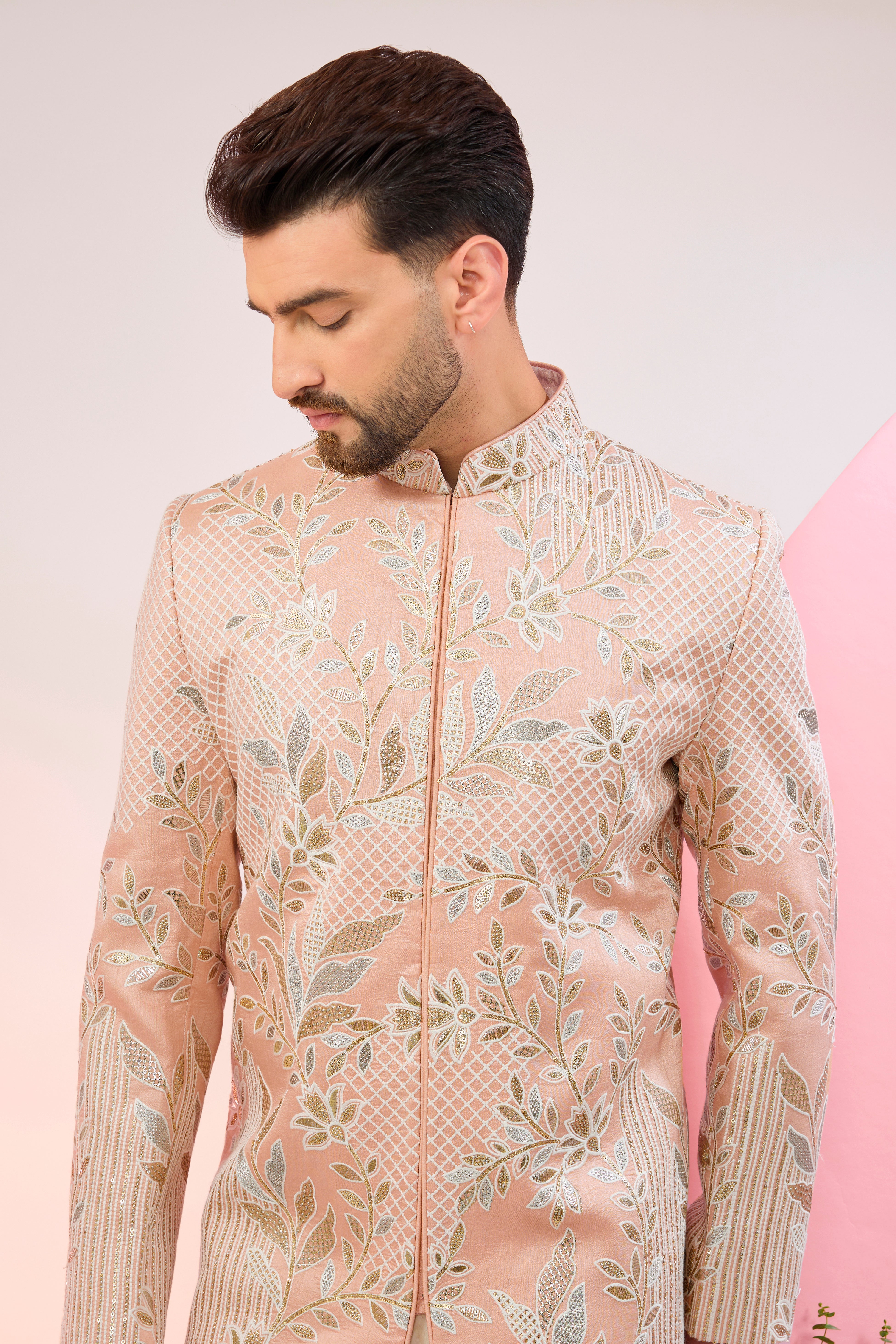 peach sherwani with intricate floral embroidery and subtle sequin work