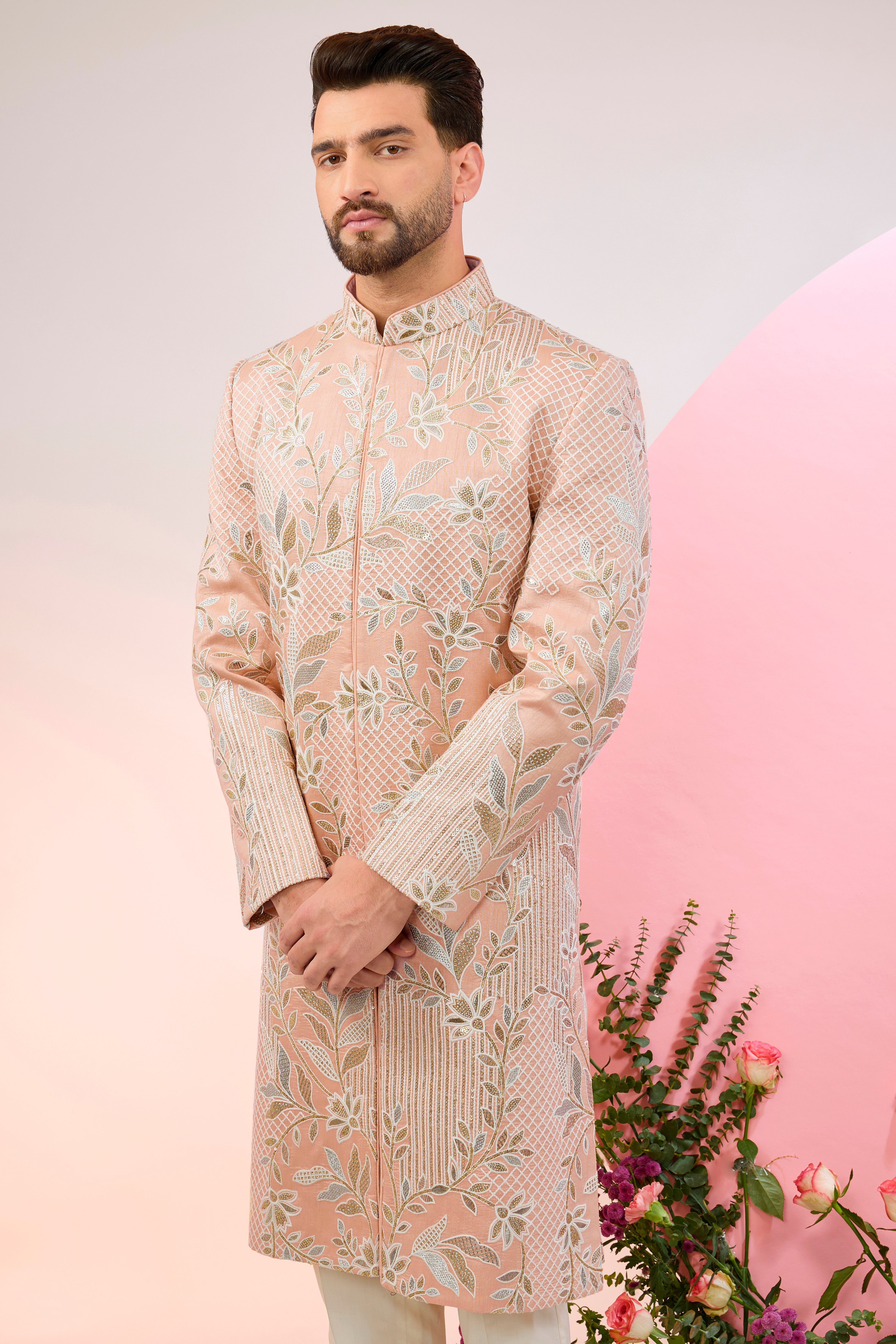 peach sherwani with intricate floral embroidery and subtle sequin work