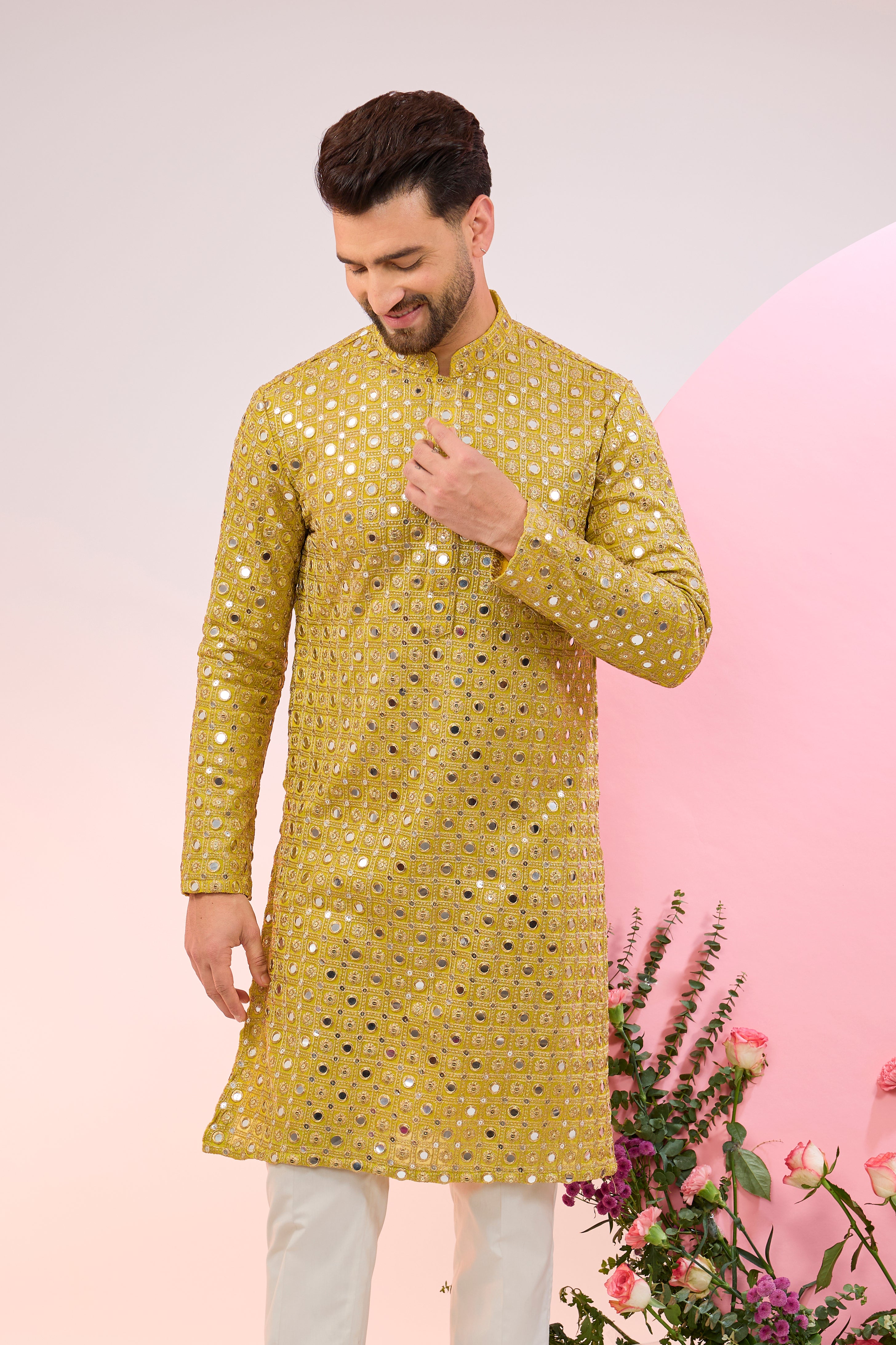 Neon yellow mirror work kurta with intricate zari embroidery.