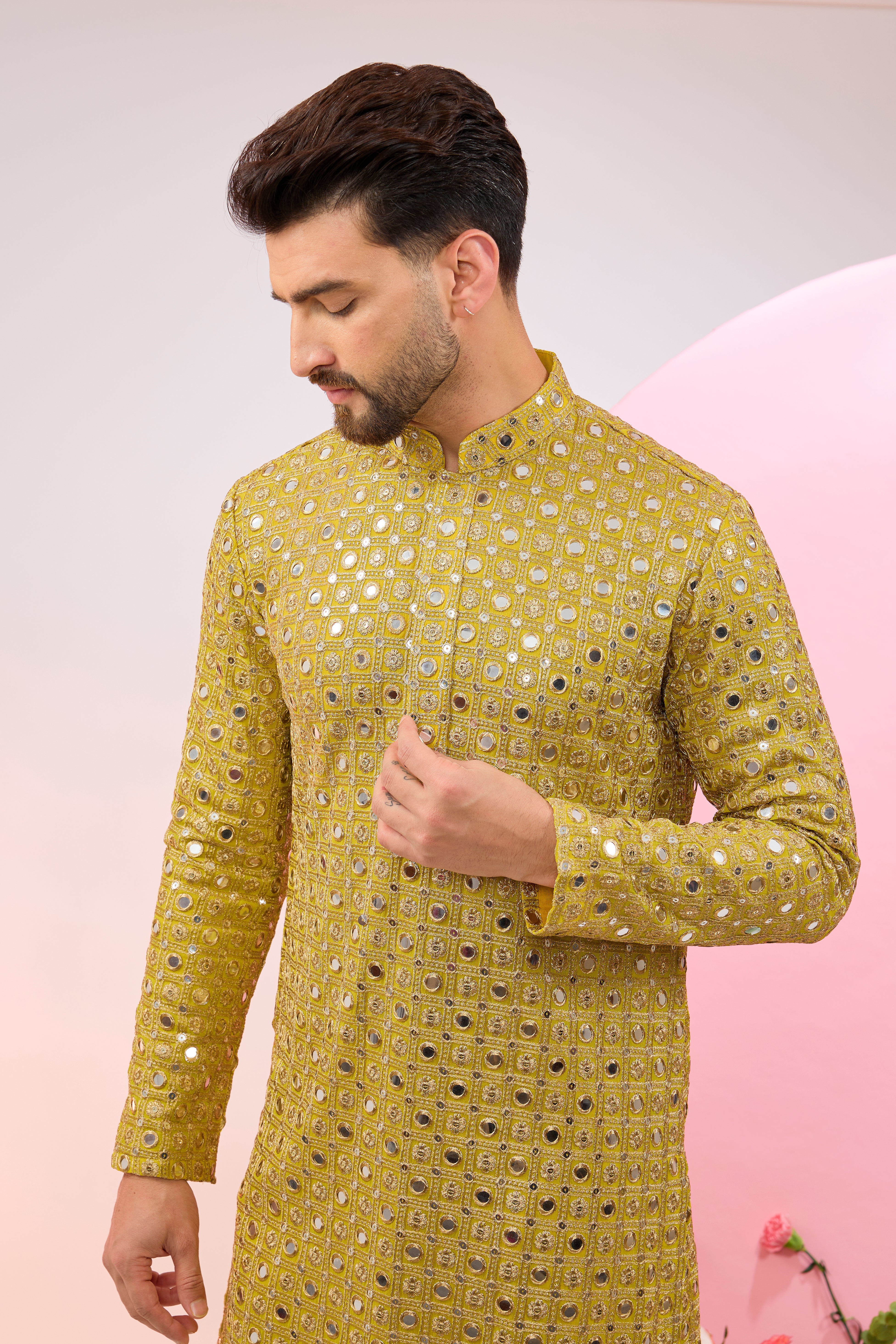 Neon yellow mirror work kurta with intricate zari embroidery.