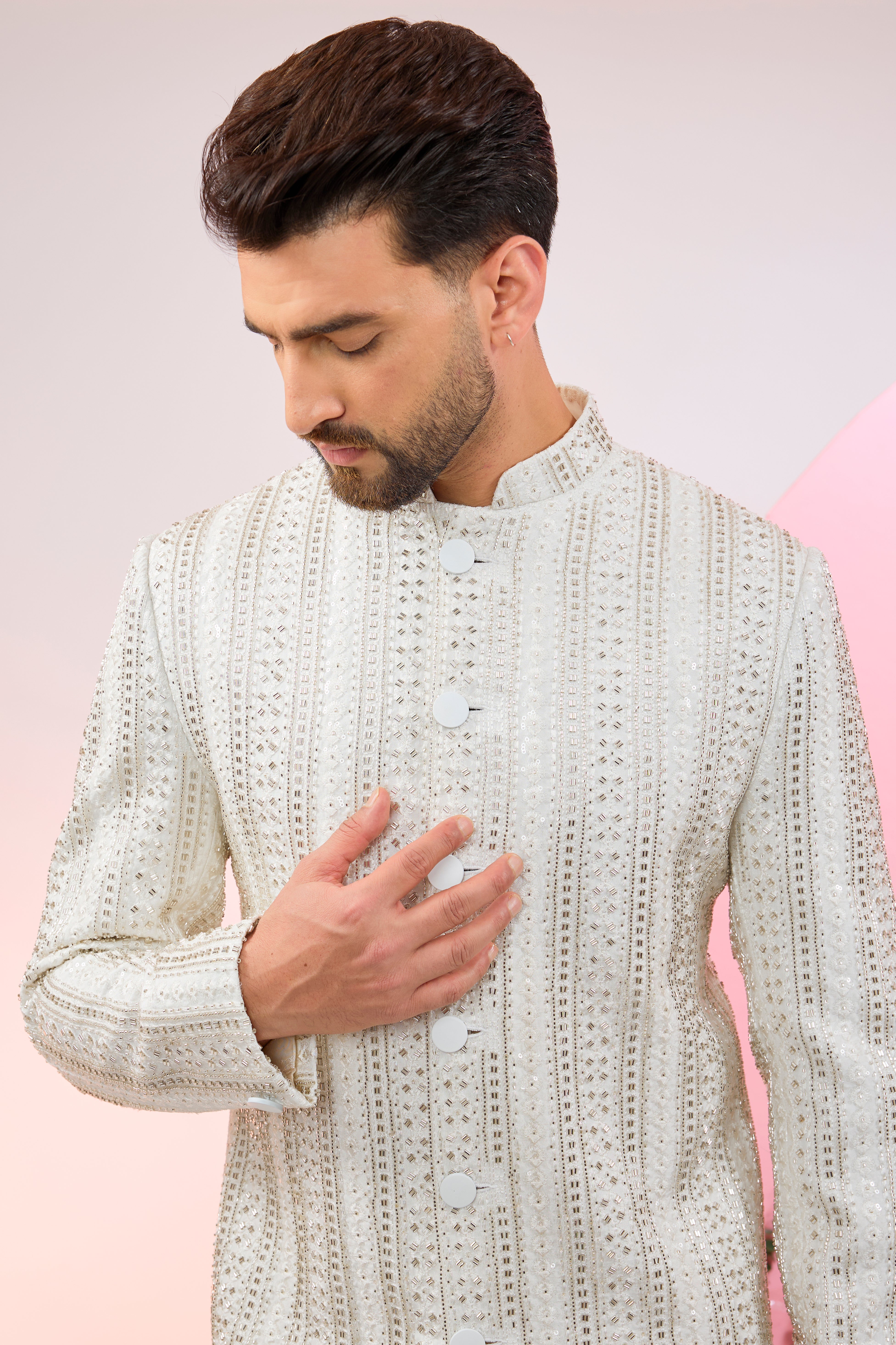 white sherwani with intricate cut dana embroidery