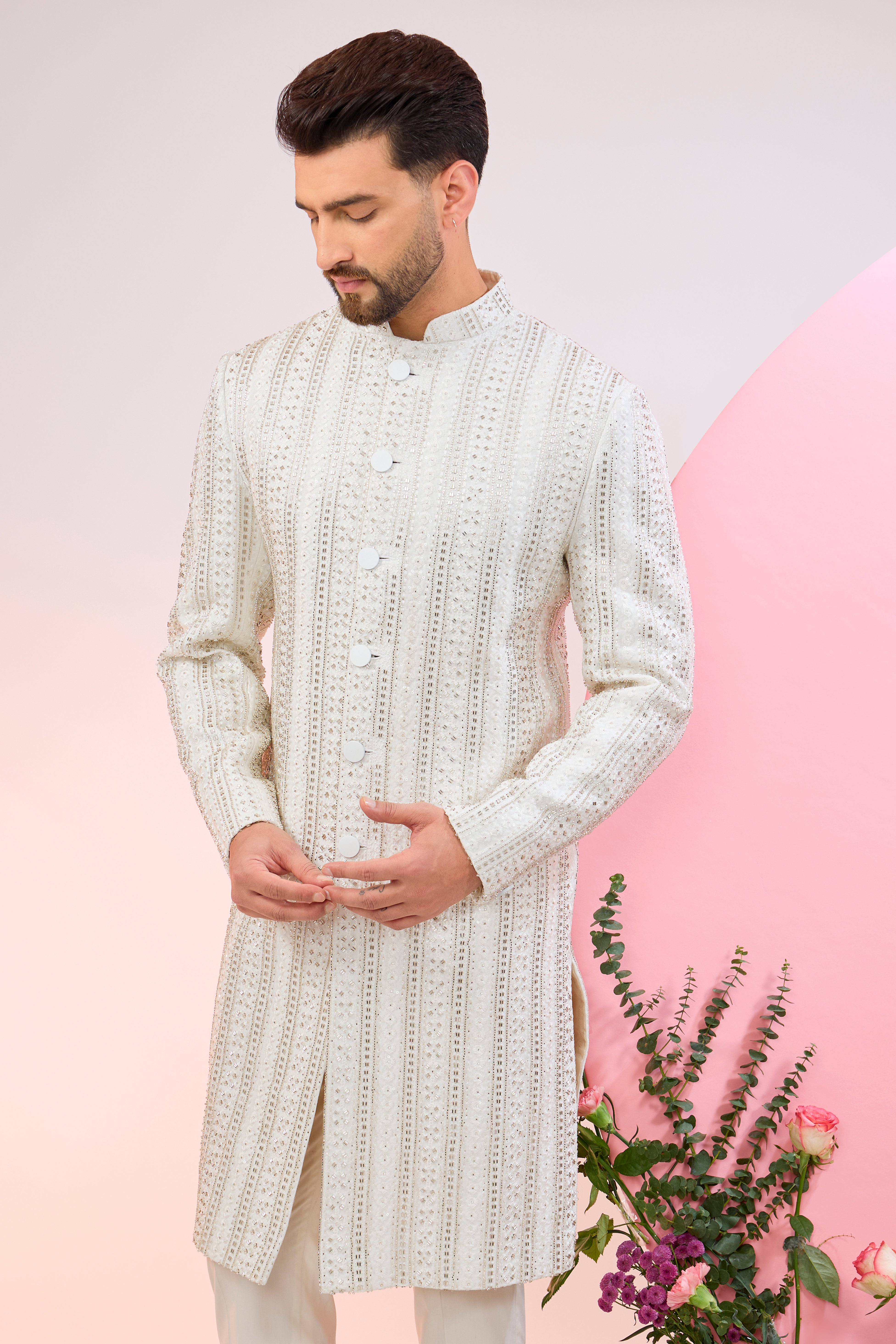 white sherwani with intricate cut dana embroidery