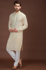 Beige hand embrodried mirror work kurtabeige hand embrodried mirror work kurta - kasbahmen